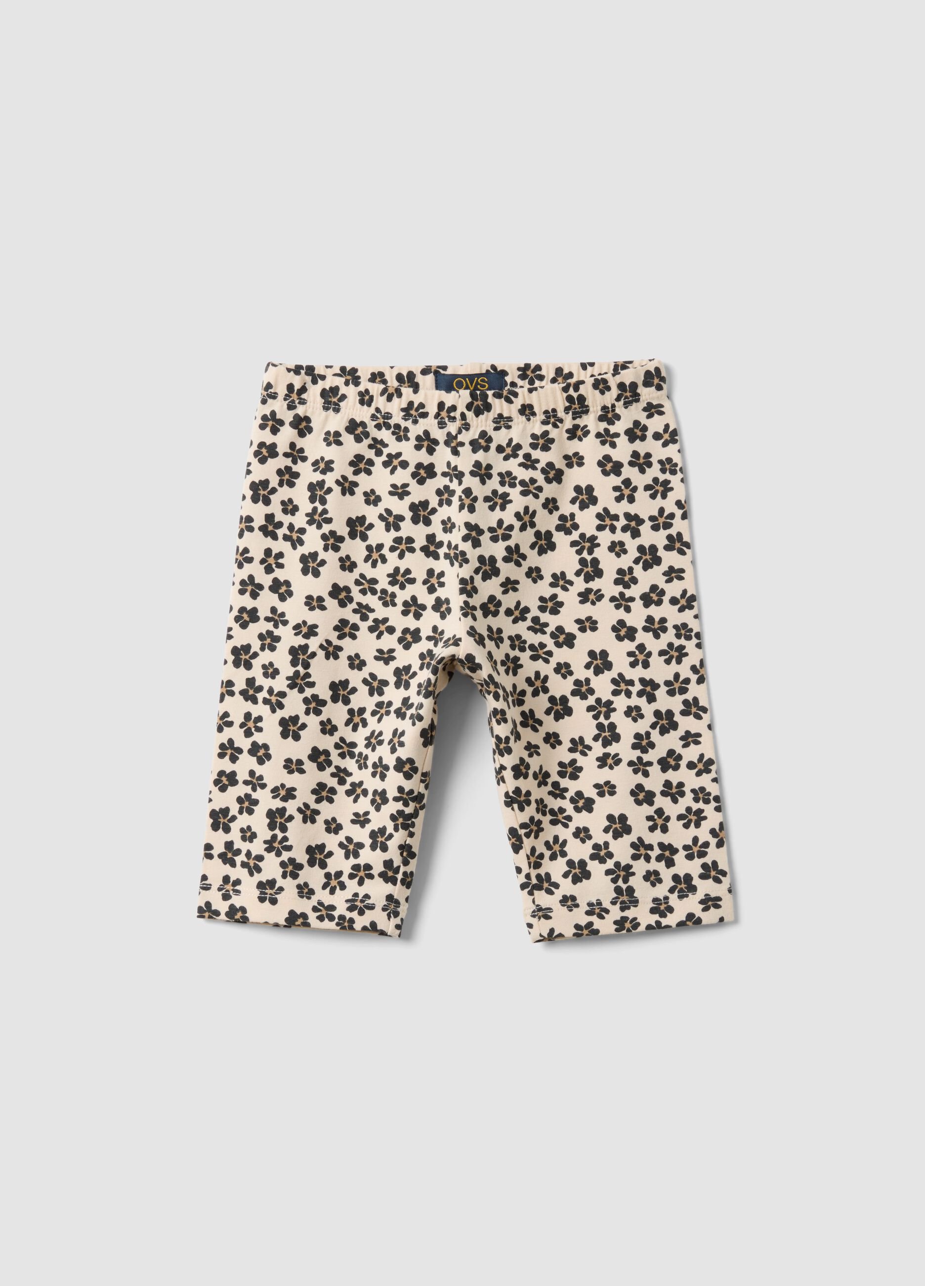 Beige organic cotton shorts with floral print