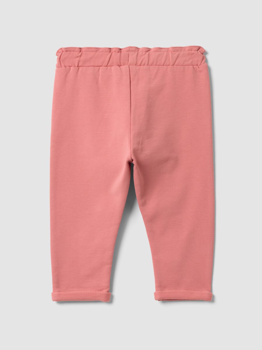 Jogger rosa in cotone elasticizzato con risvolto per bimba_1