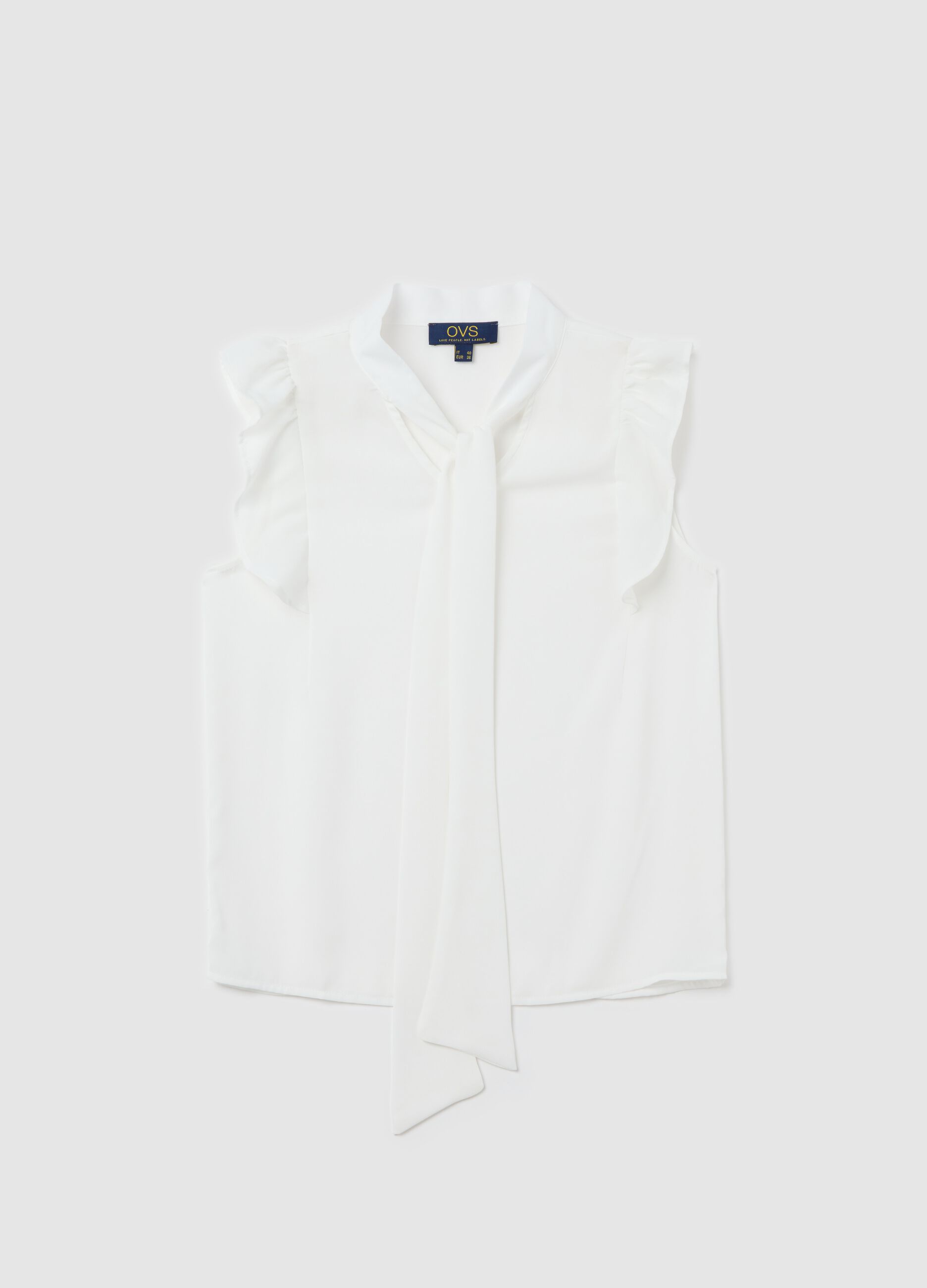 White sleeveless blouse with flounce