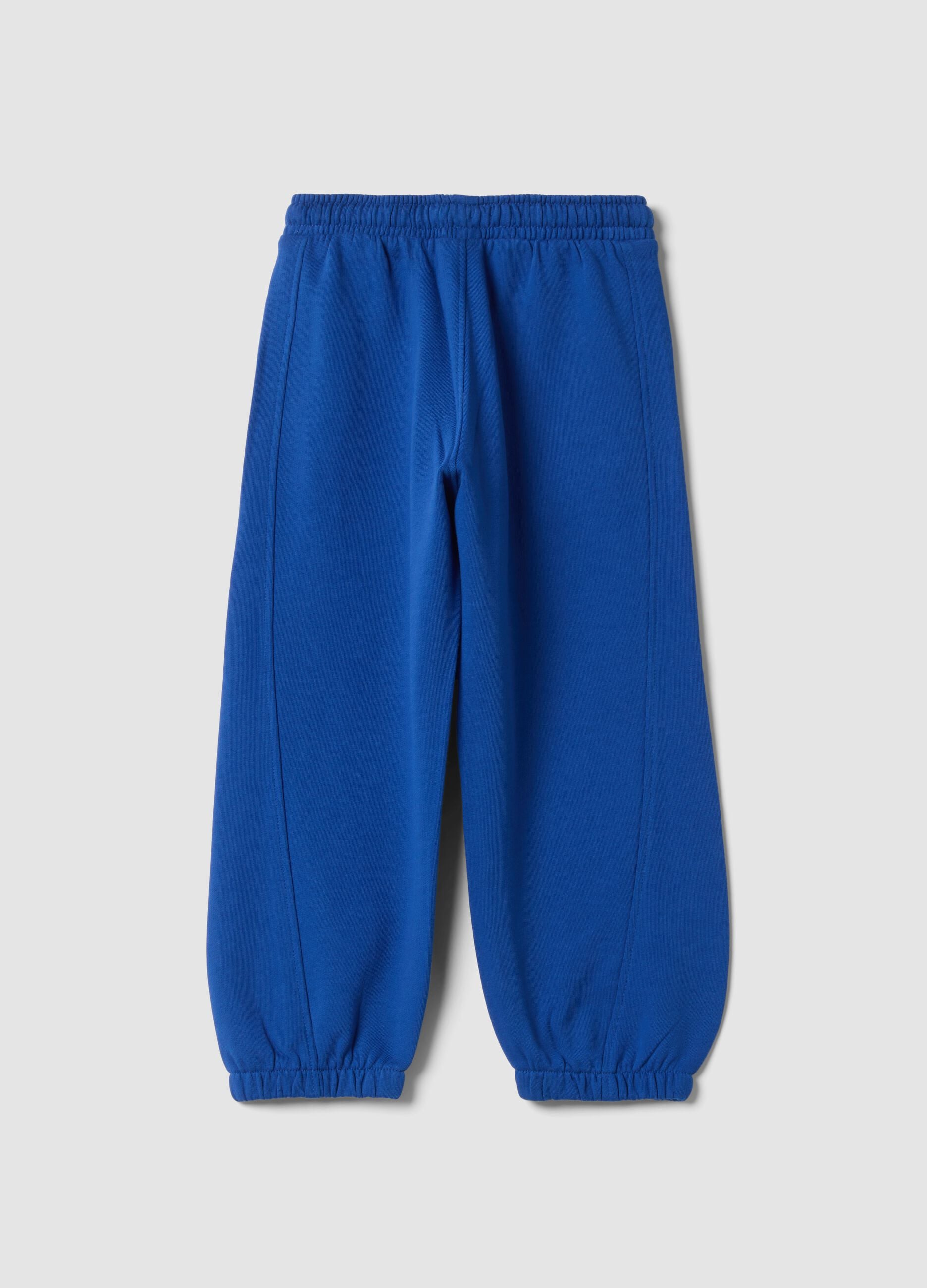 Pantaloni jogger blu in puro cotone organico con stampa