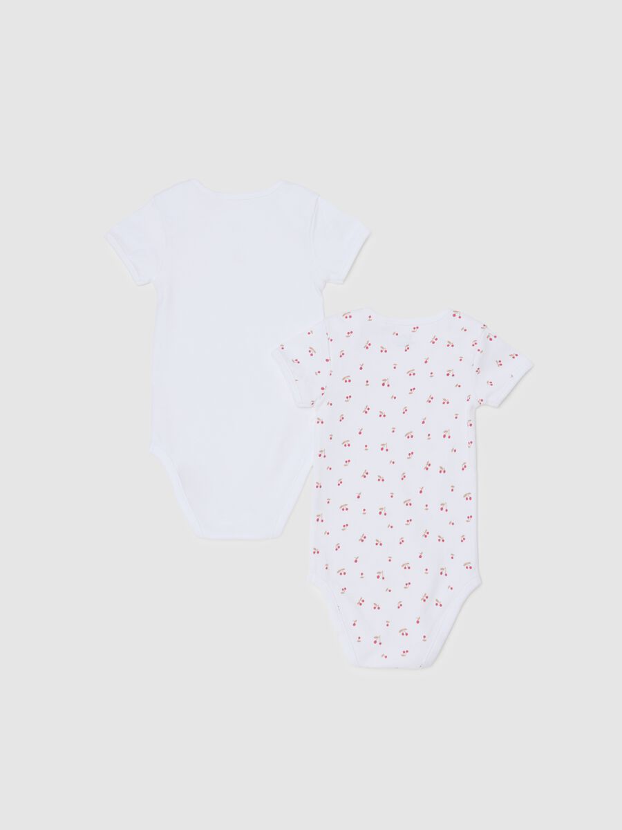 Set of two white pure cotton bodysuits for baby girls_1