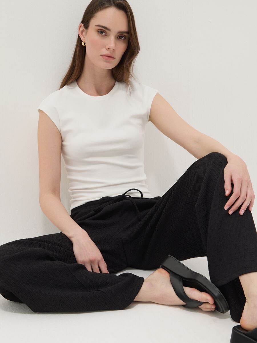 Black wide-leg jogger trousers_0