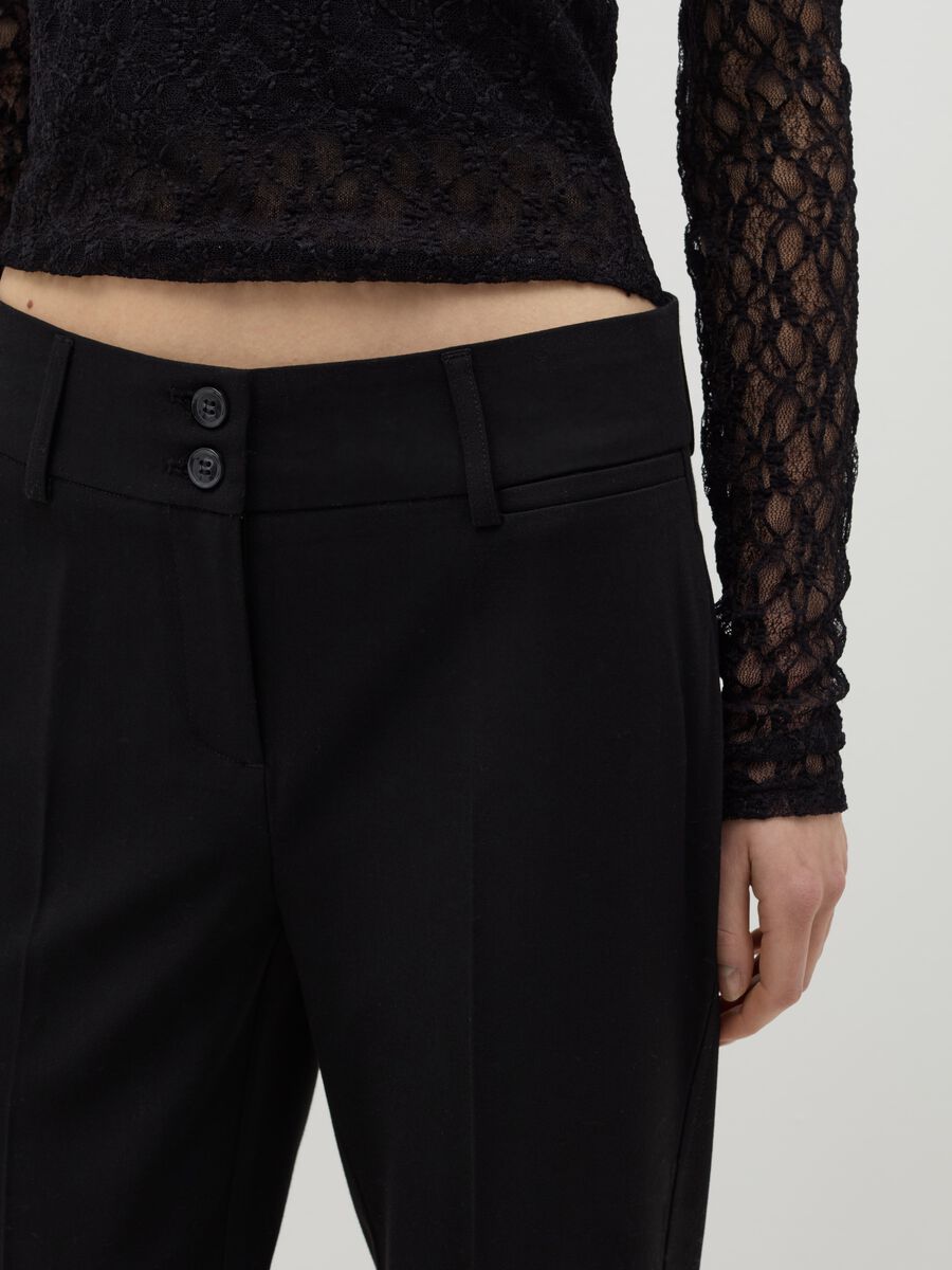 Flare-fit trousers with double button_3