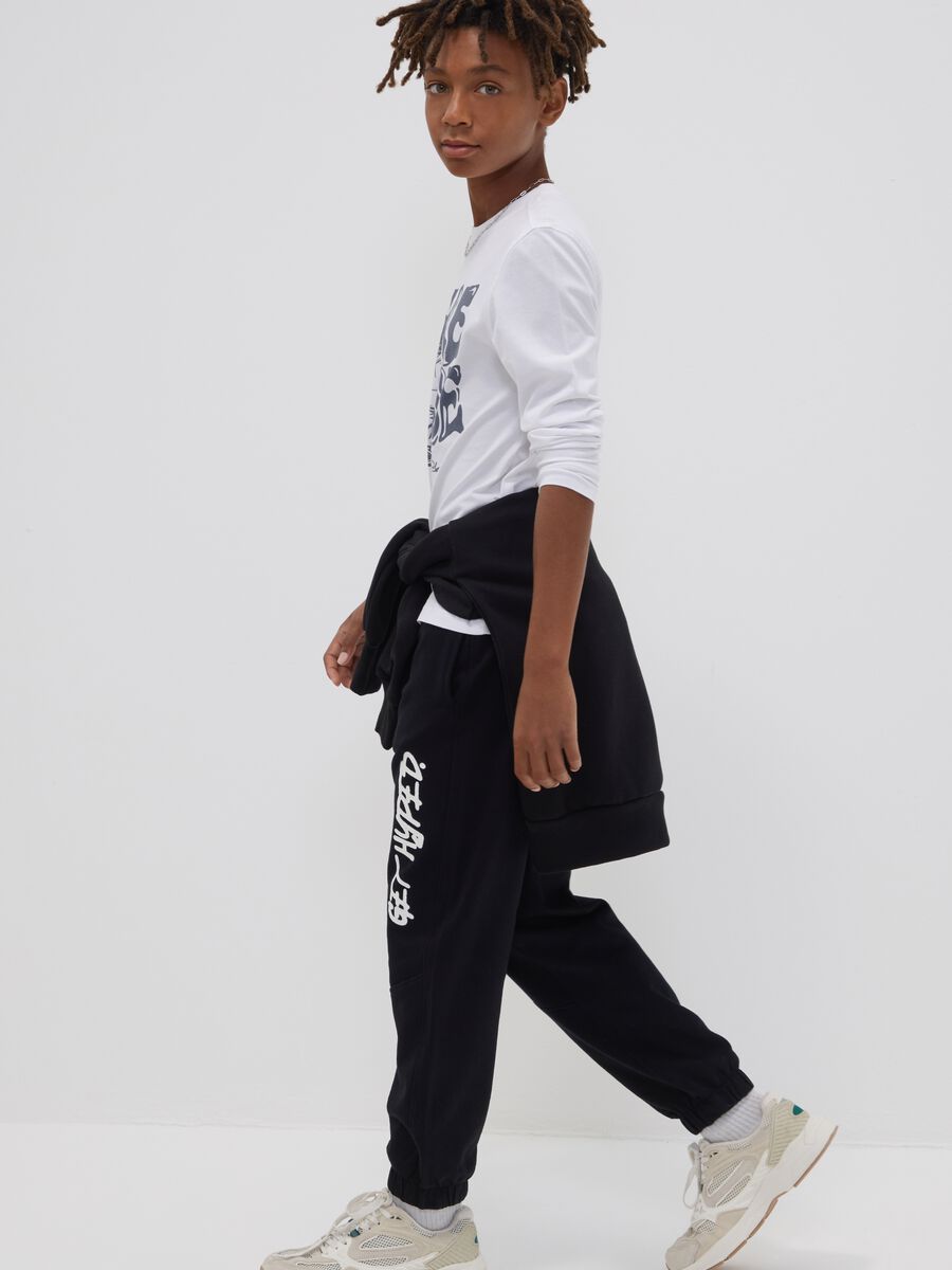 Pantaloni jogger over fit blu in puro cotone con scritta "Get Hyped" per ragazzo_0