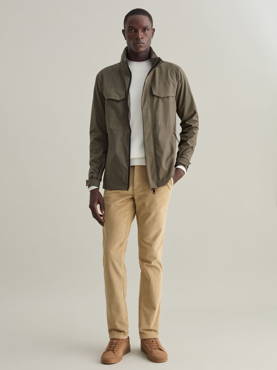 Short jacket in technical fabric with high neck_1