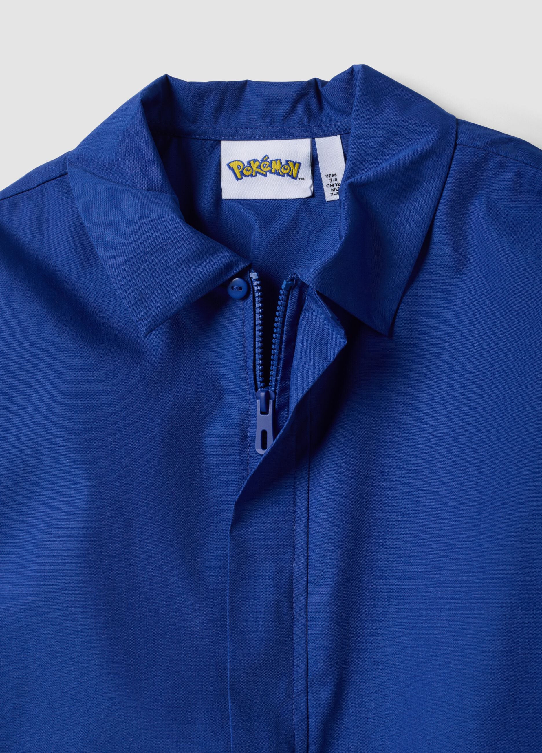 Blue kids&rsquo; school apron with zip and Pok&eacute;mon embroidery
