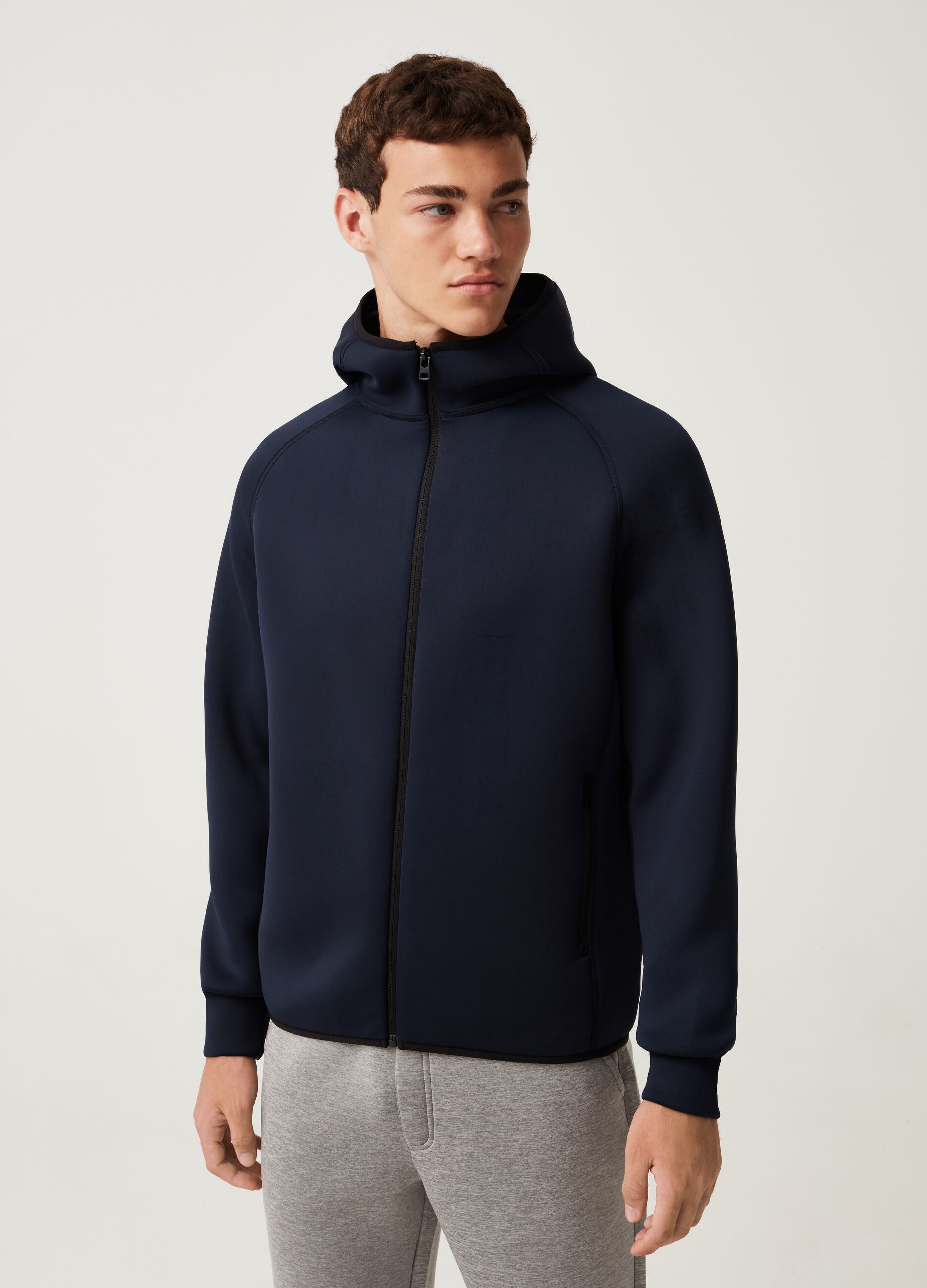 Full-zip sweatshirt with hood and raglan sleeves.