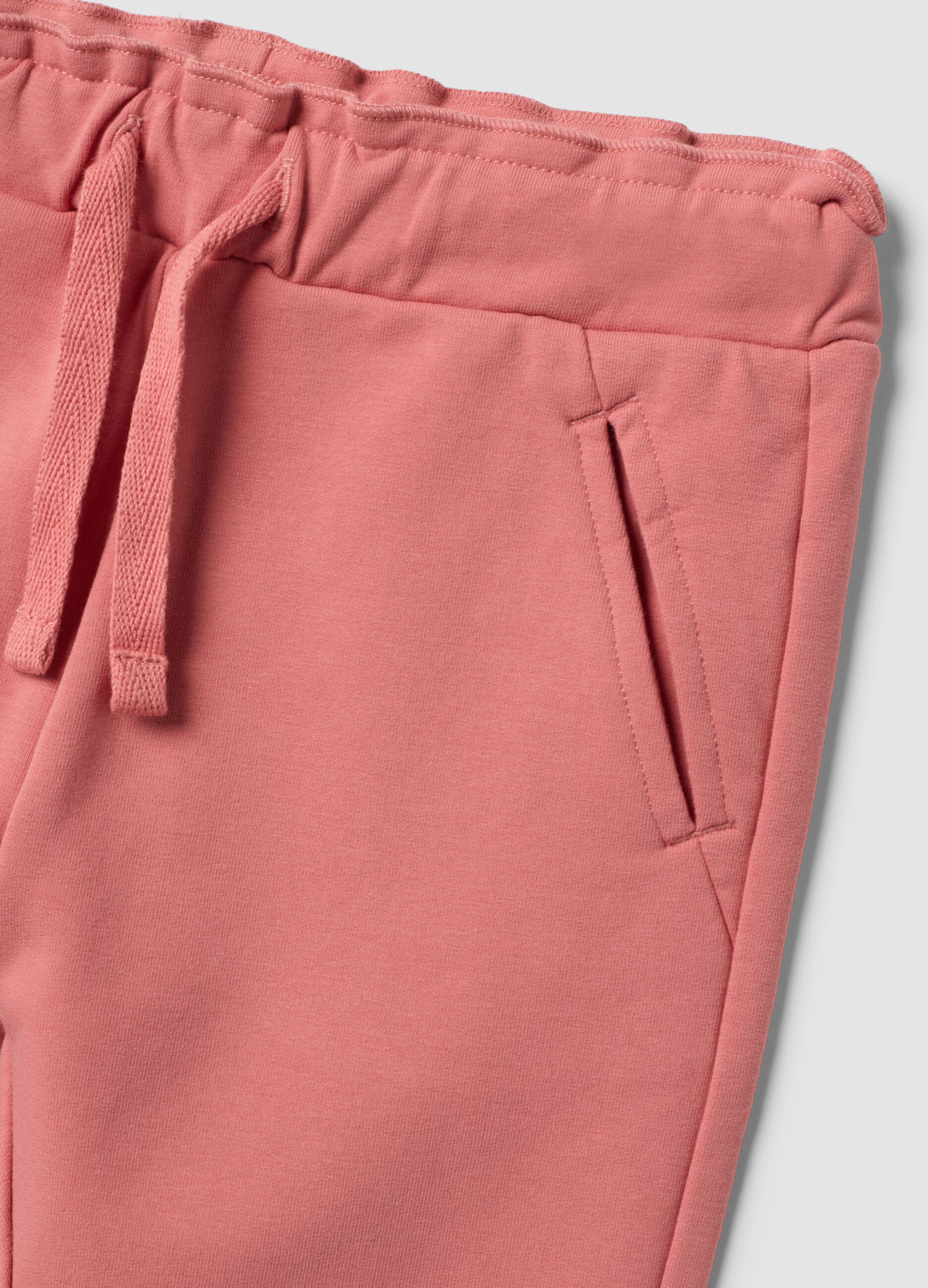 Pink stretch cotton joggers with turn-up hem for baby girl