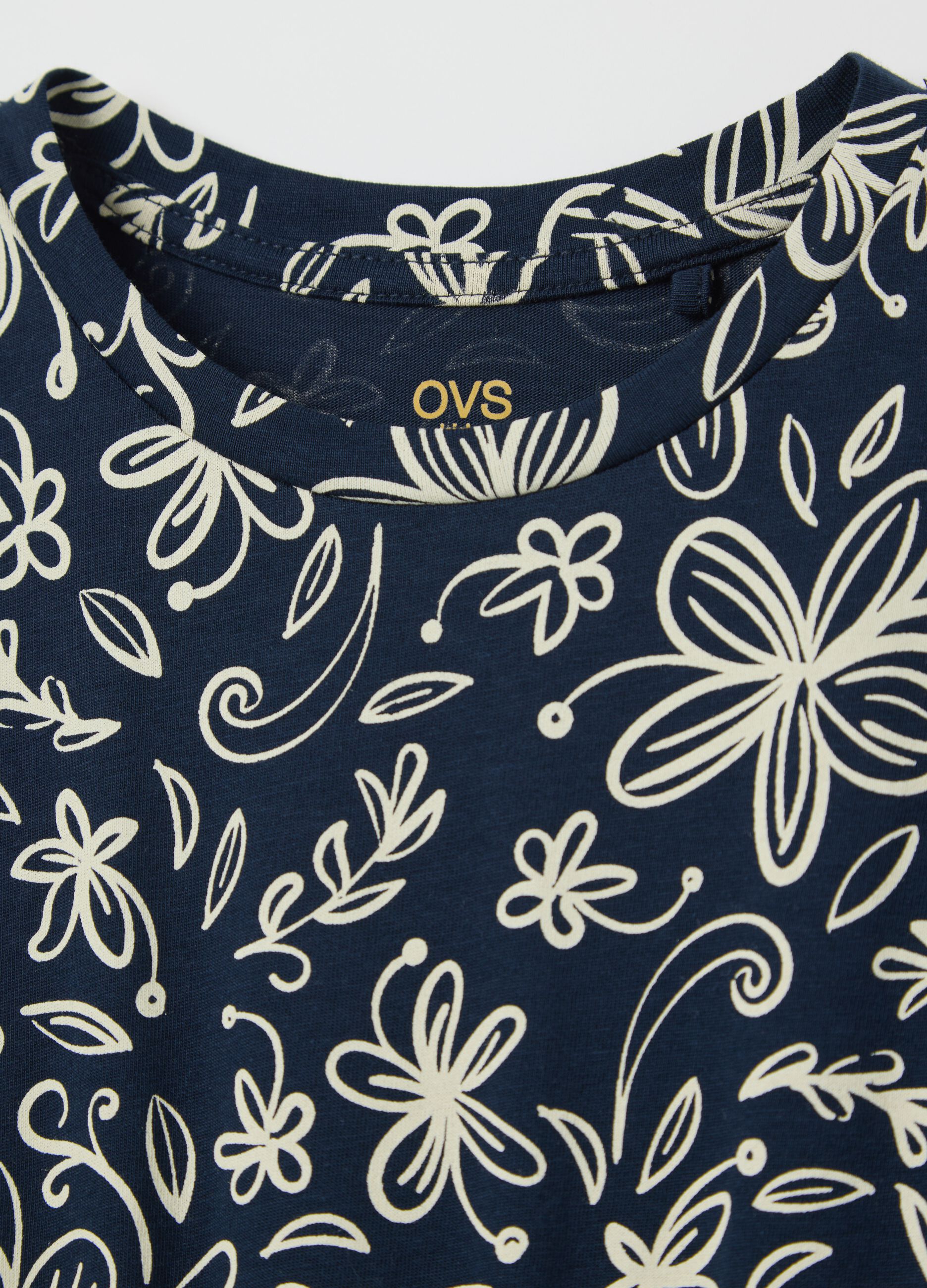 Blue sleeveless dress with floral motifs