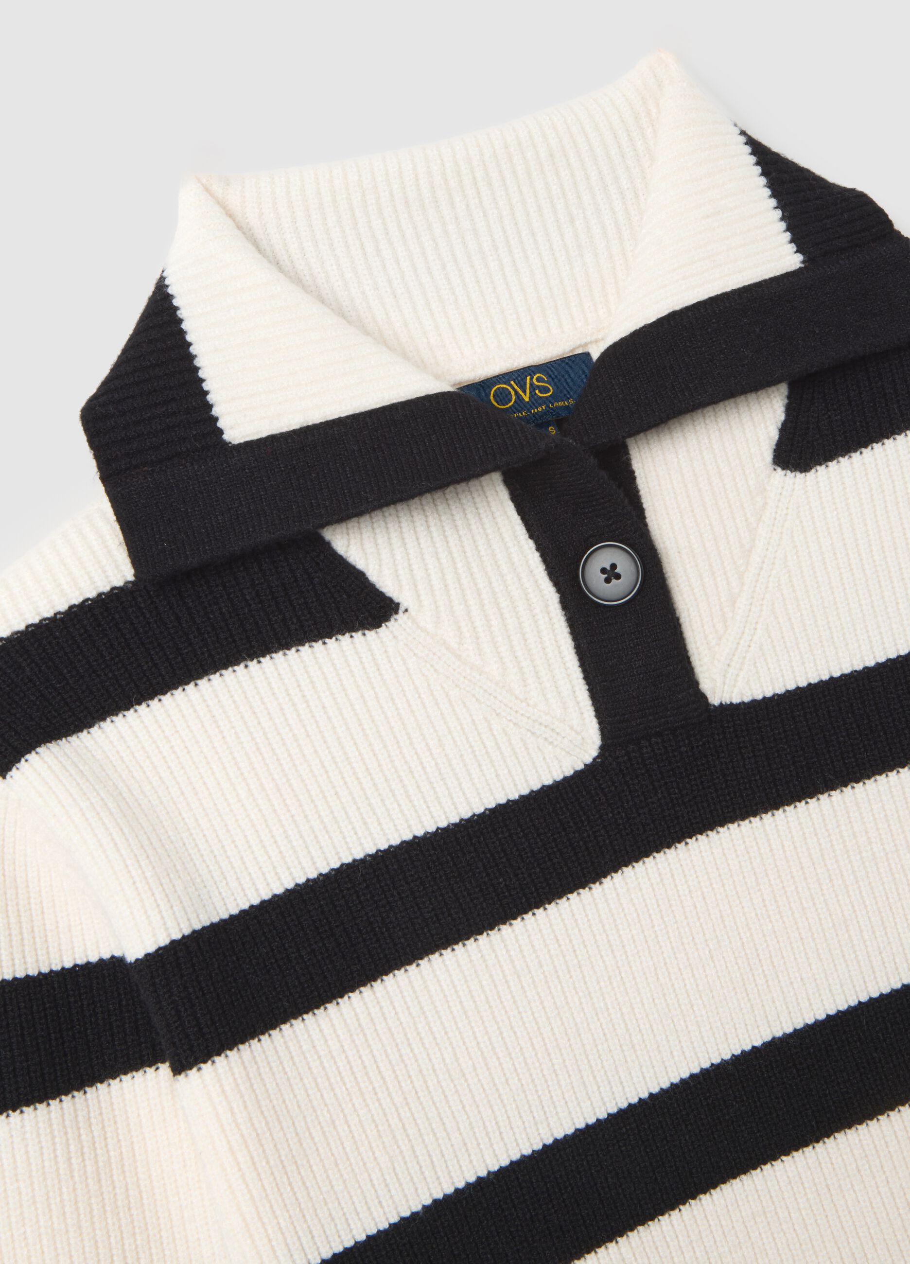 White jumper with black stripes and collar