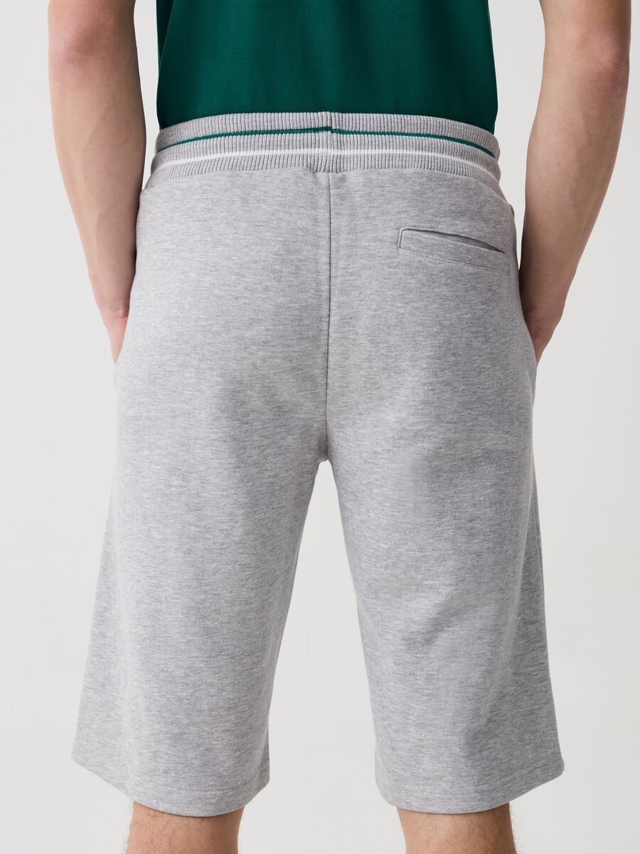 Bermuda joggers with logo print and striped edging_2