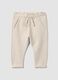 Beige stretch cotton joggers with turn-up cuff for baby girl_0