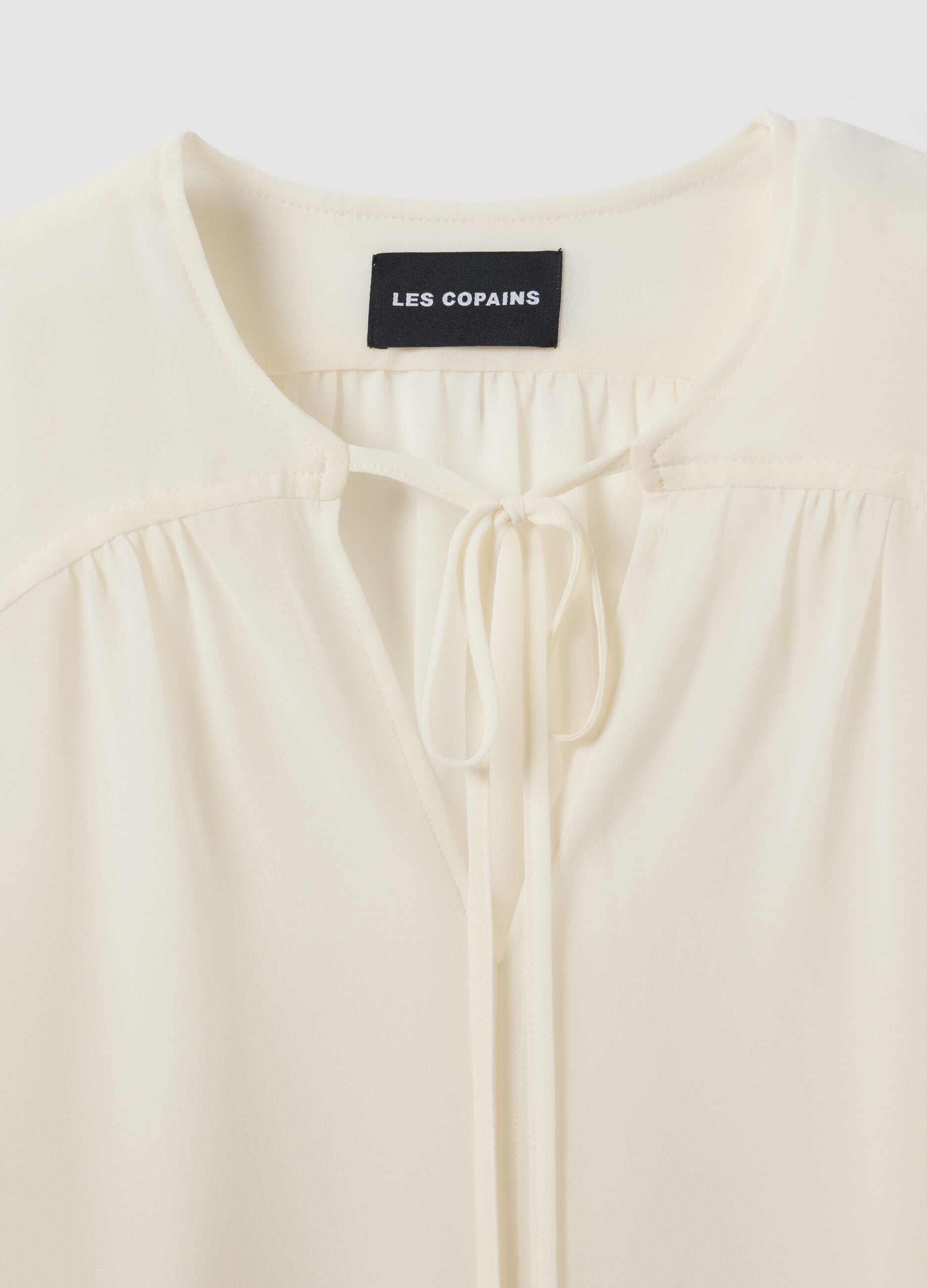White regular-fit blouse with V-neck and tie detail