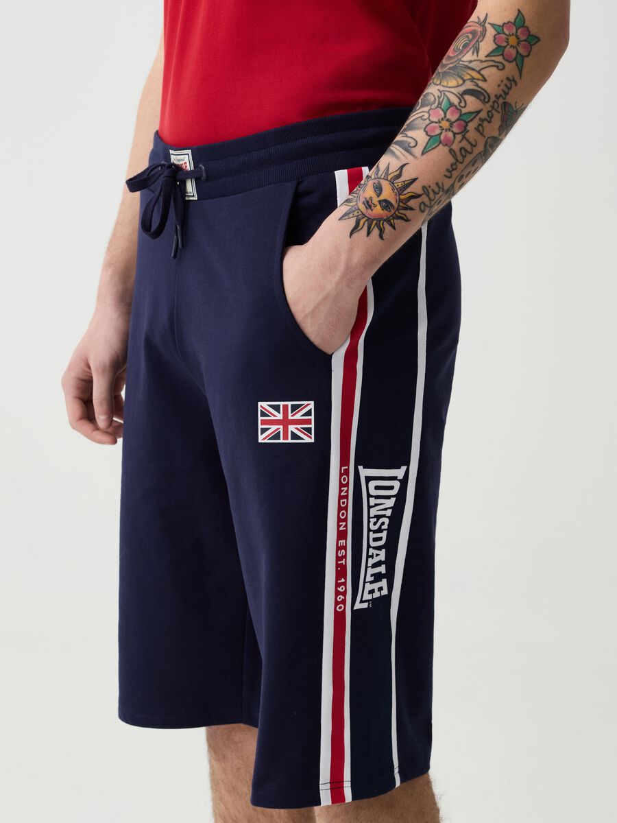 Bermuda joggers with logo print and contrasting bands_1