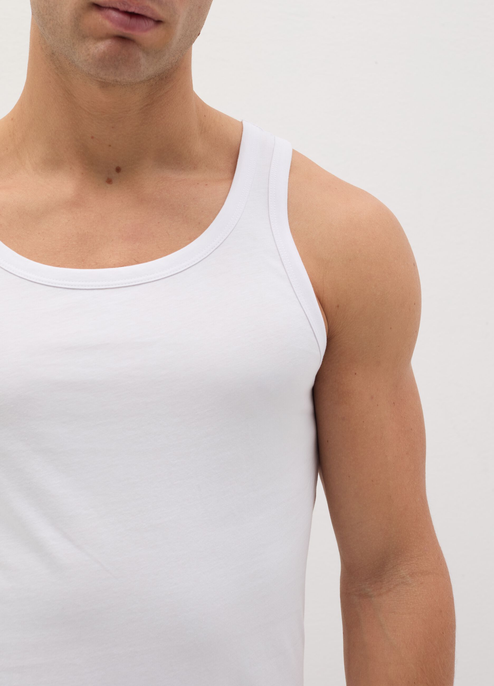 Three-pack racerback vests in organic cotton