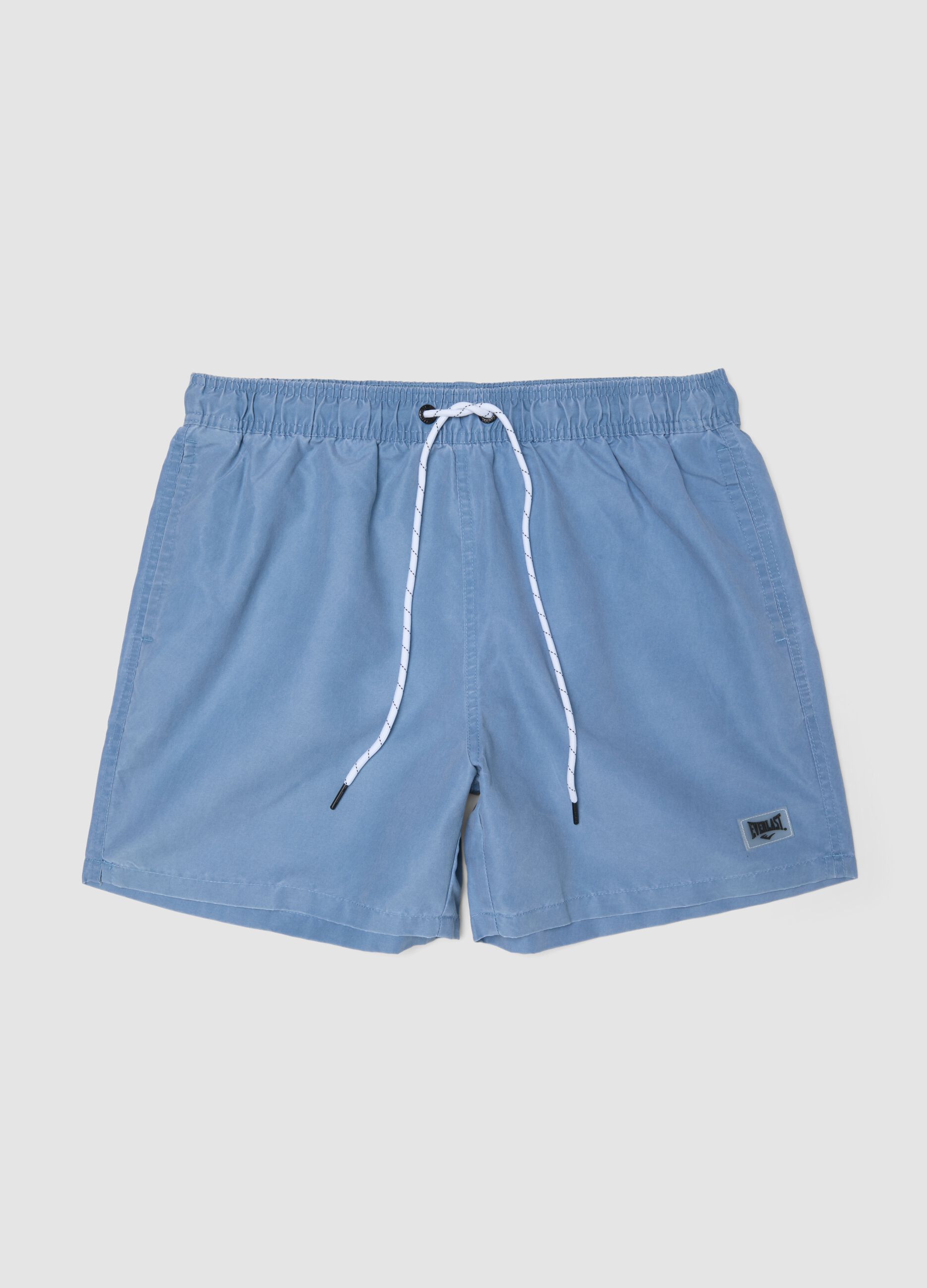 Blue swim shorts with drawstring waist