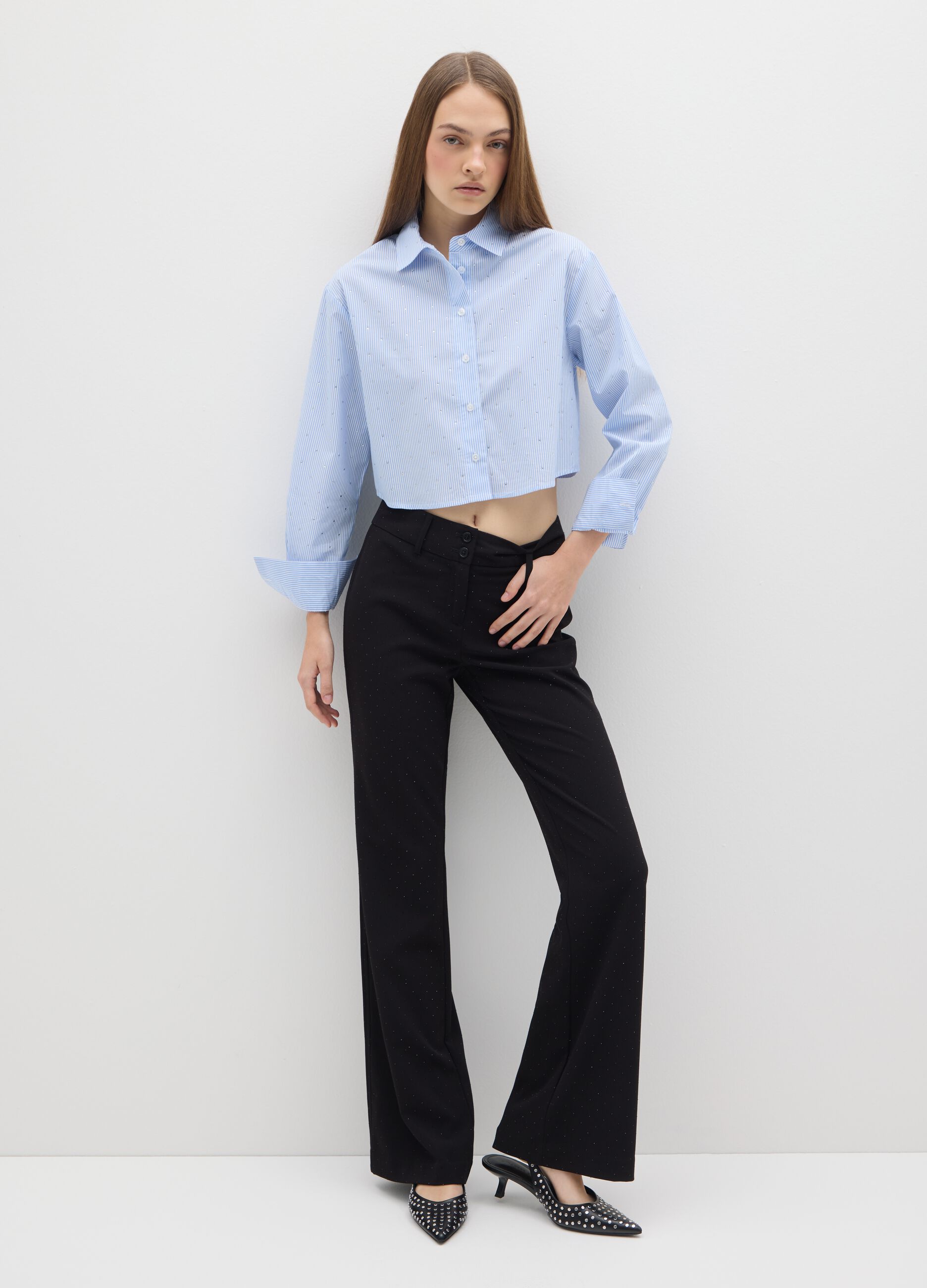 Black polka dot flare trousers