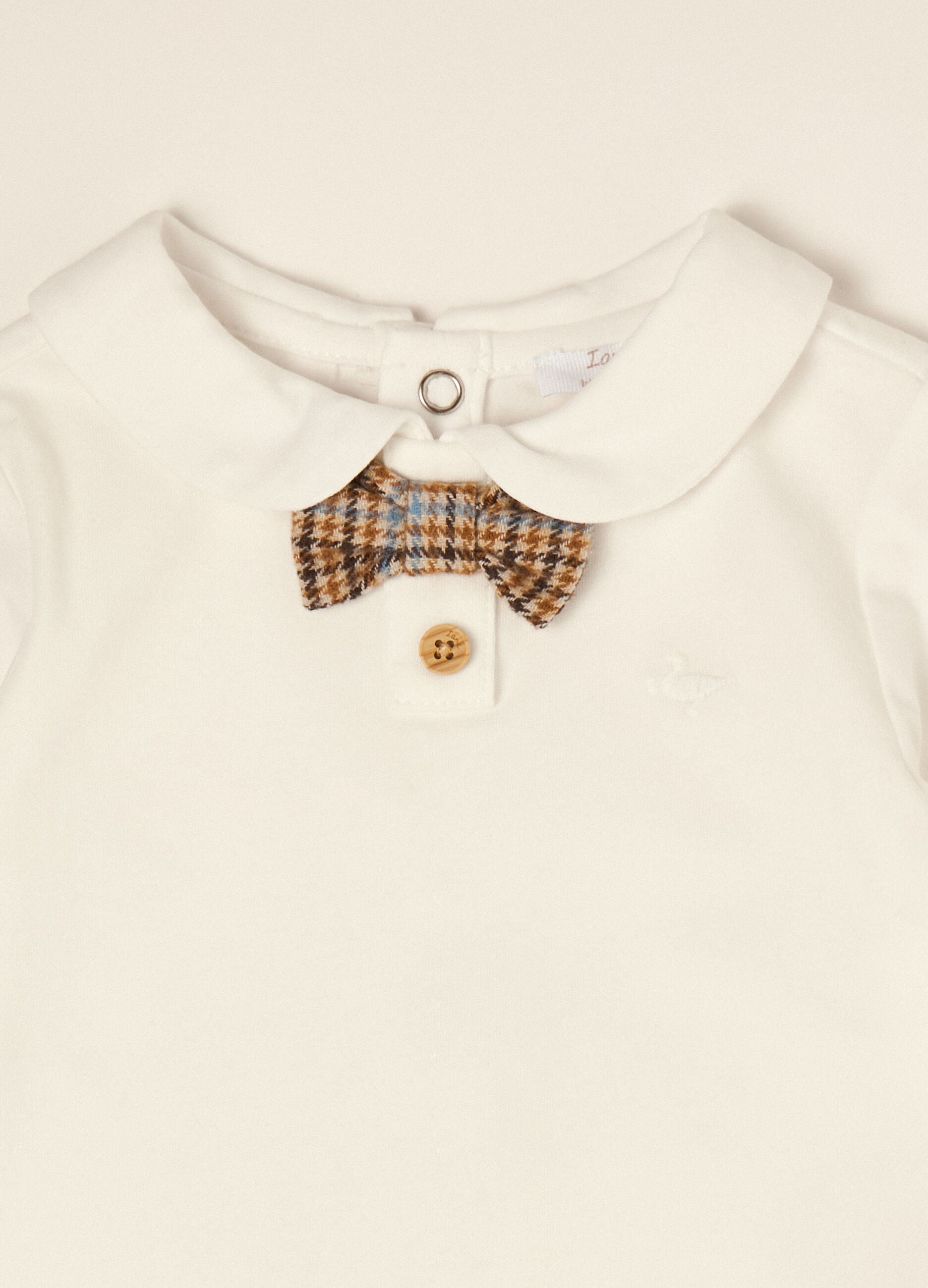 White organic stretch cotton baby bodysuit with bow