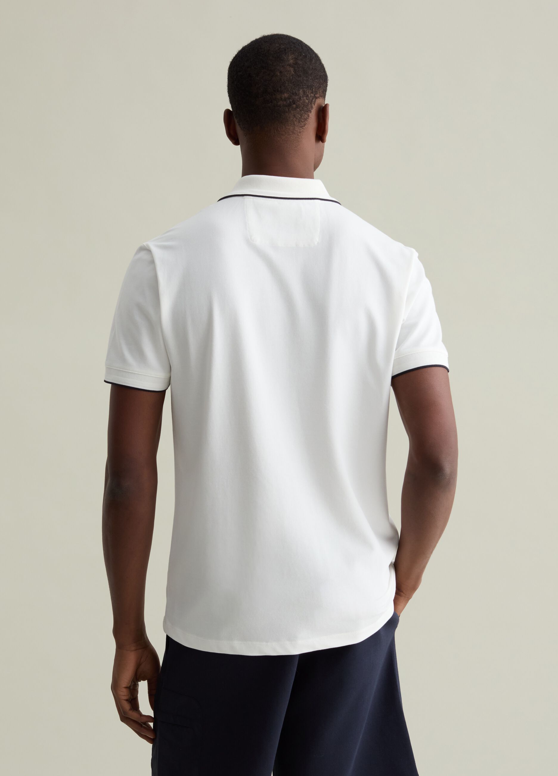 Polo shirt in technical fabric with contrasting edging