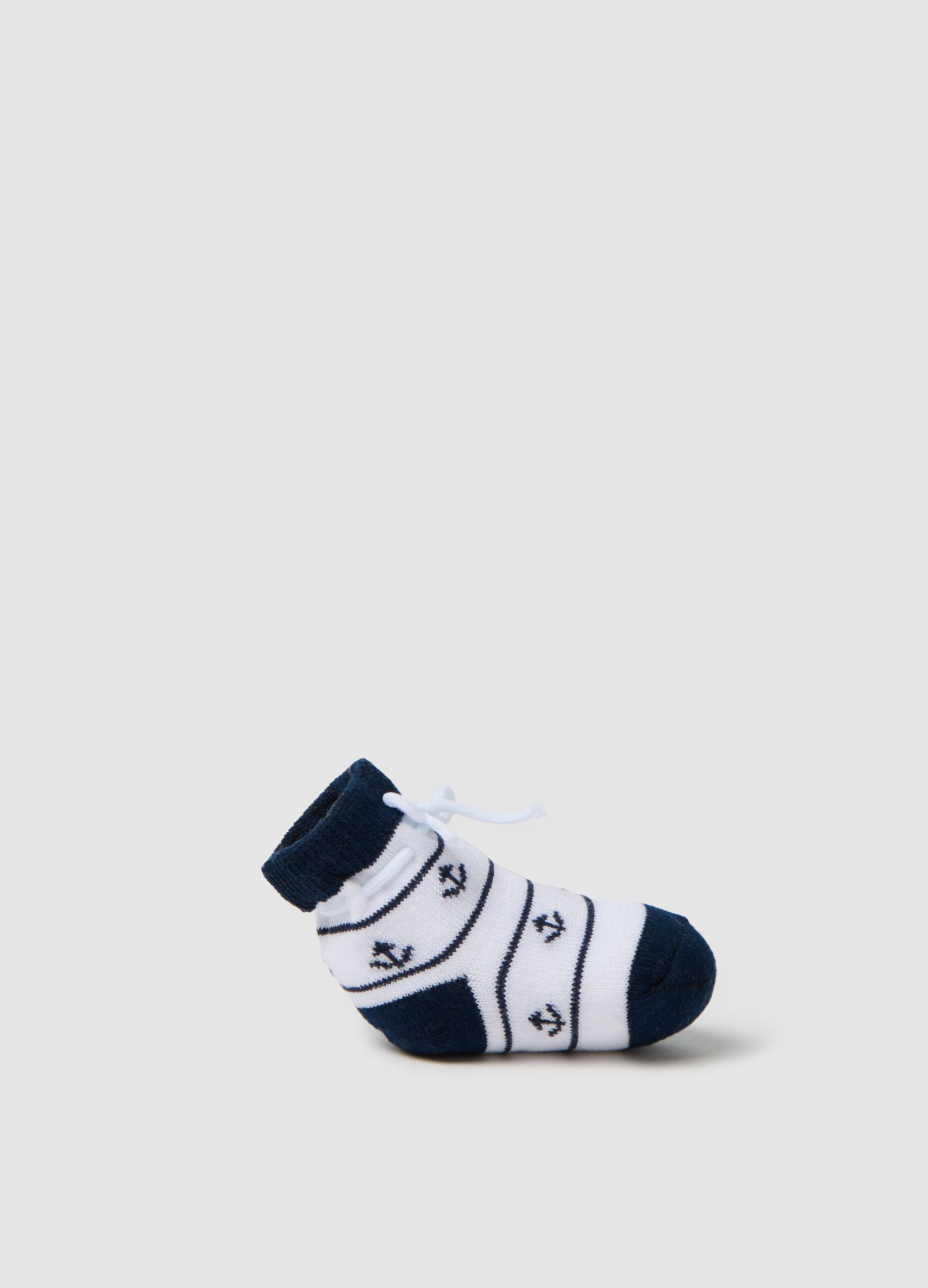 White and blue knit shoes with anchors embroidery