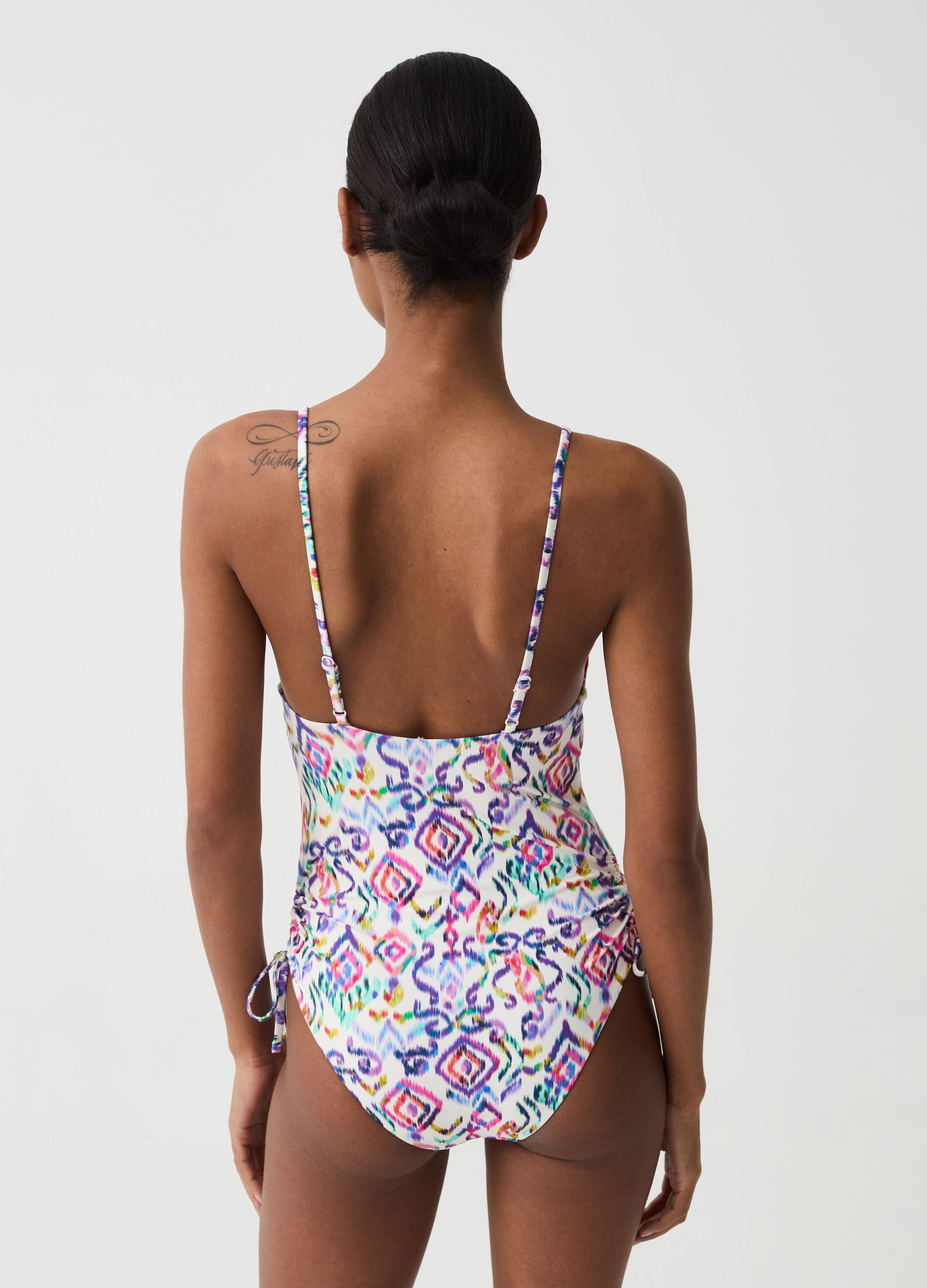 One-piece swimsuit with drawstring and ikat print