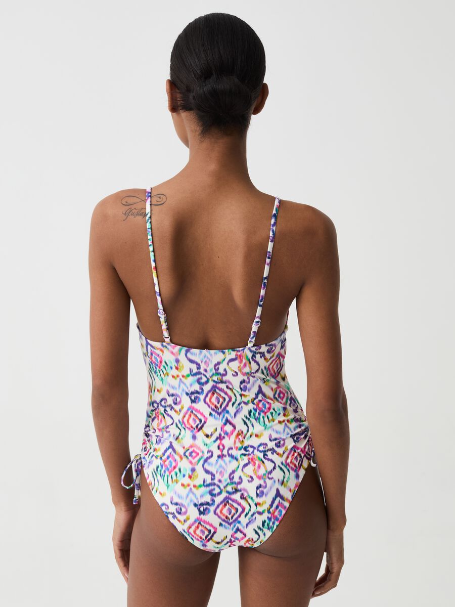 One-piece swimsuit with drawstring and ikat print_1