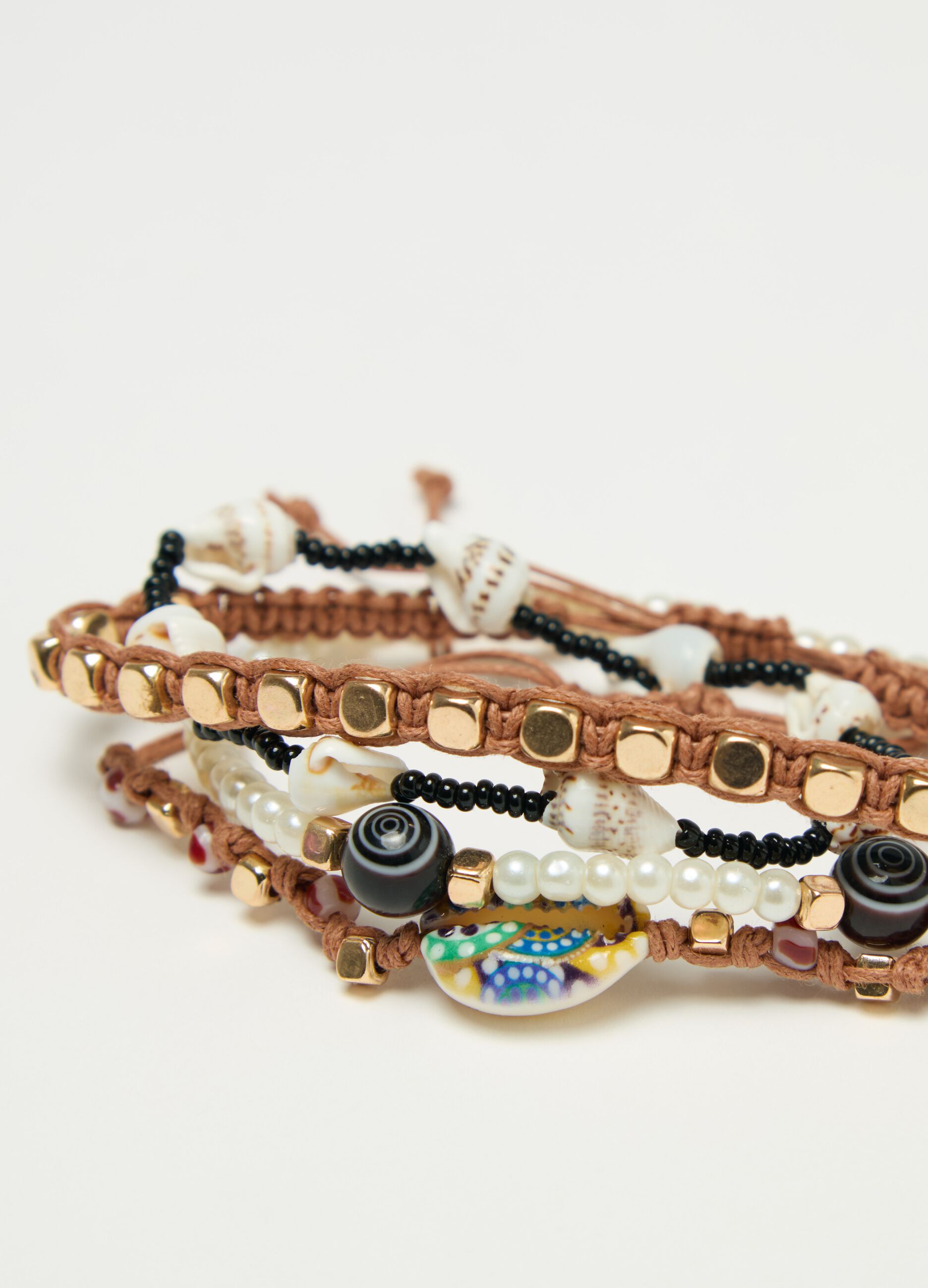 Set quattro bracciali perline e conchiglie