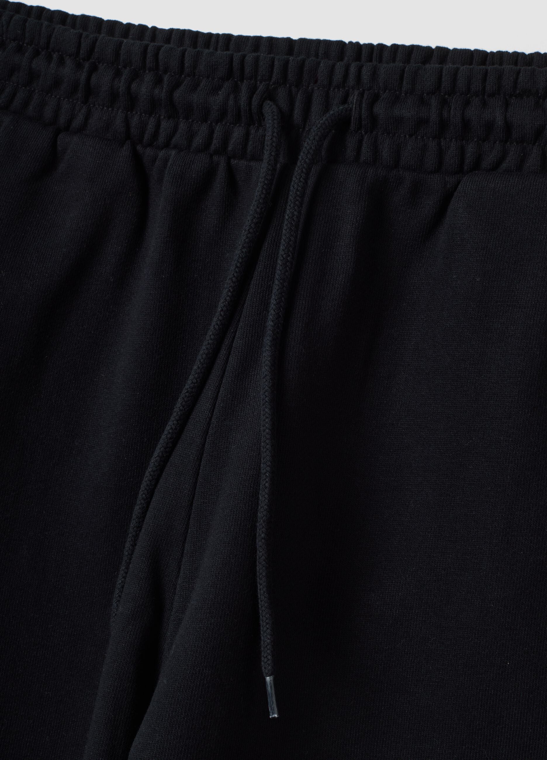 Black pure cotton joggers with elasticated waistband, oversized fit