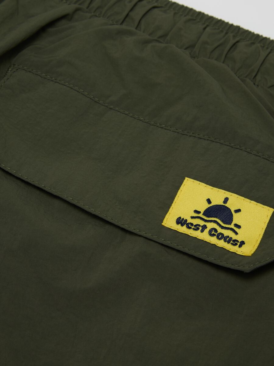 Pantaloncini da uomo in puro nylon verde con coulisse_1