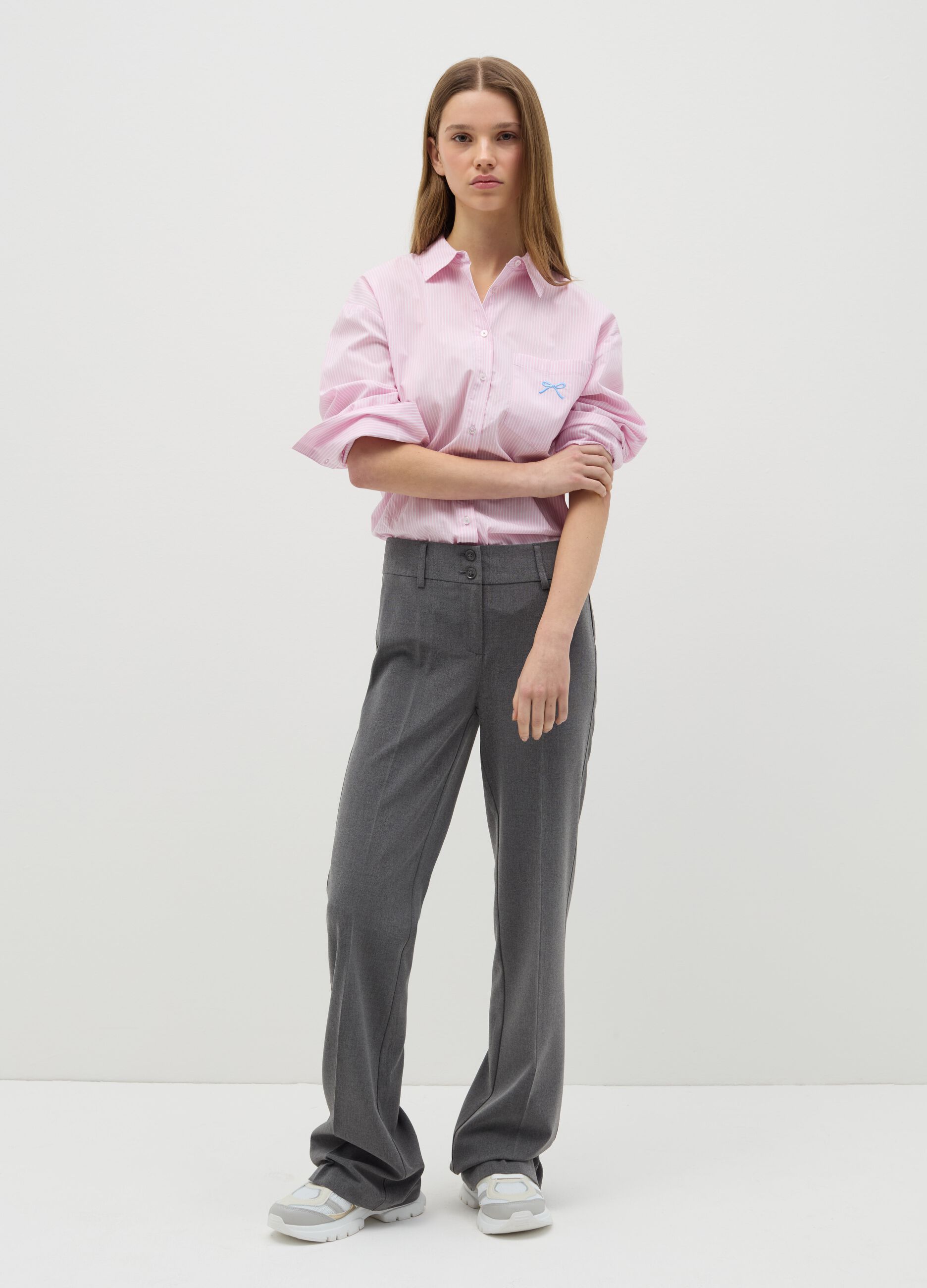 Flare-fit trousers with double button