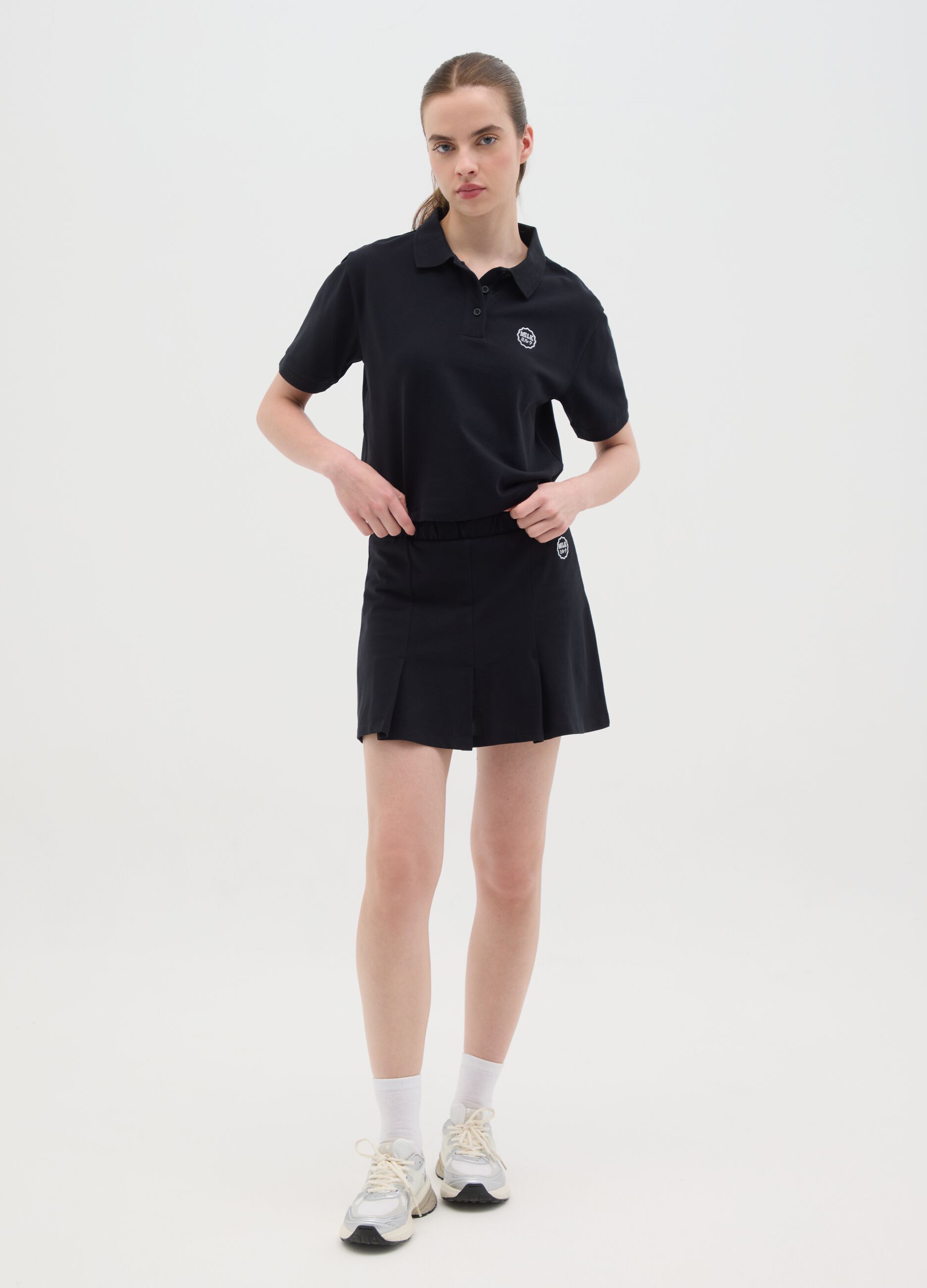 Women's black pure cotton regular fit polo with classic collar and embroidered logo