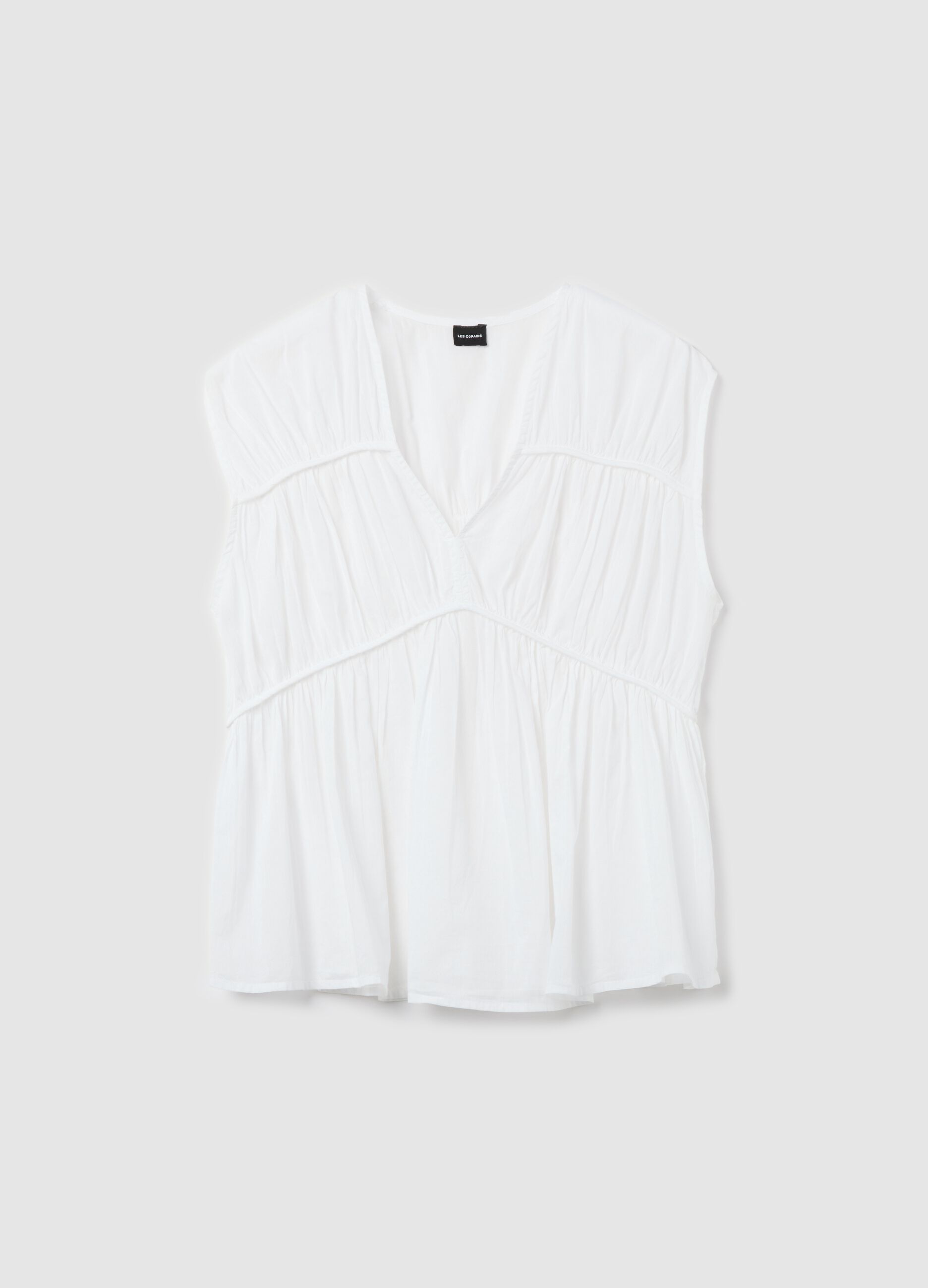 Blusa smanicata in cotone bianco con arricciature