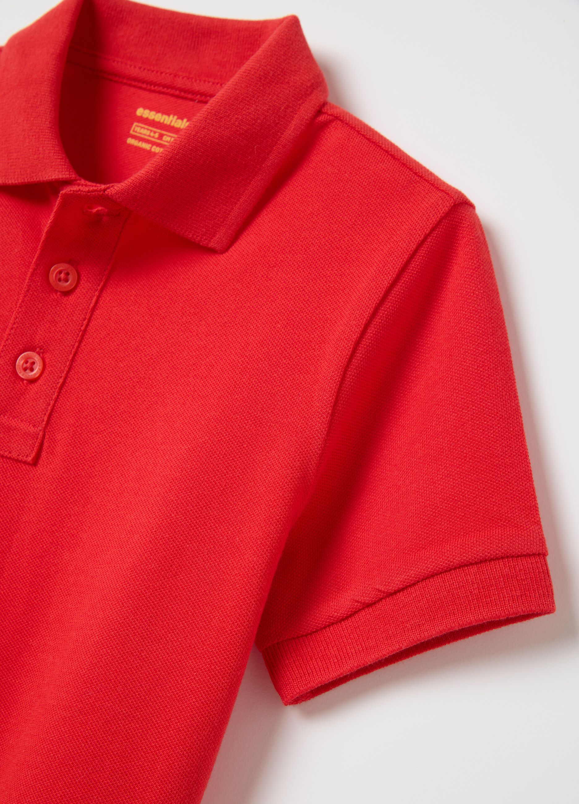Red polo shirt with short sleeves in organic cotton