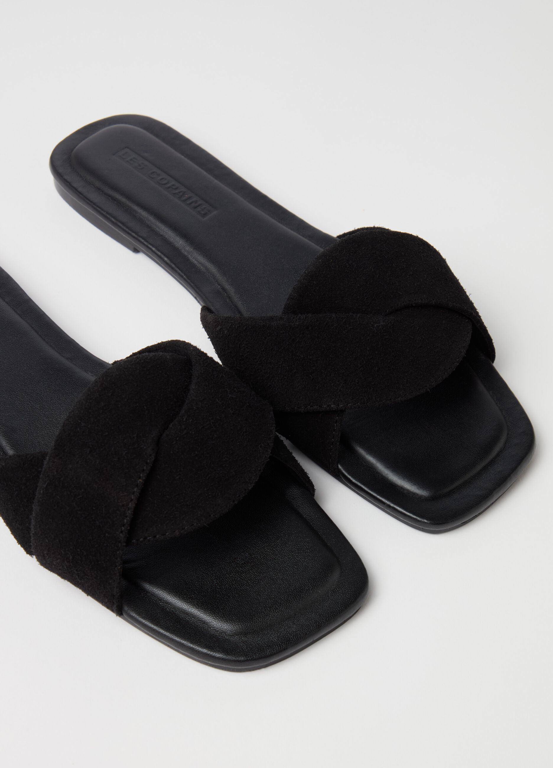 Flat open sandals in suede