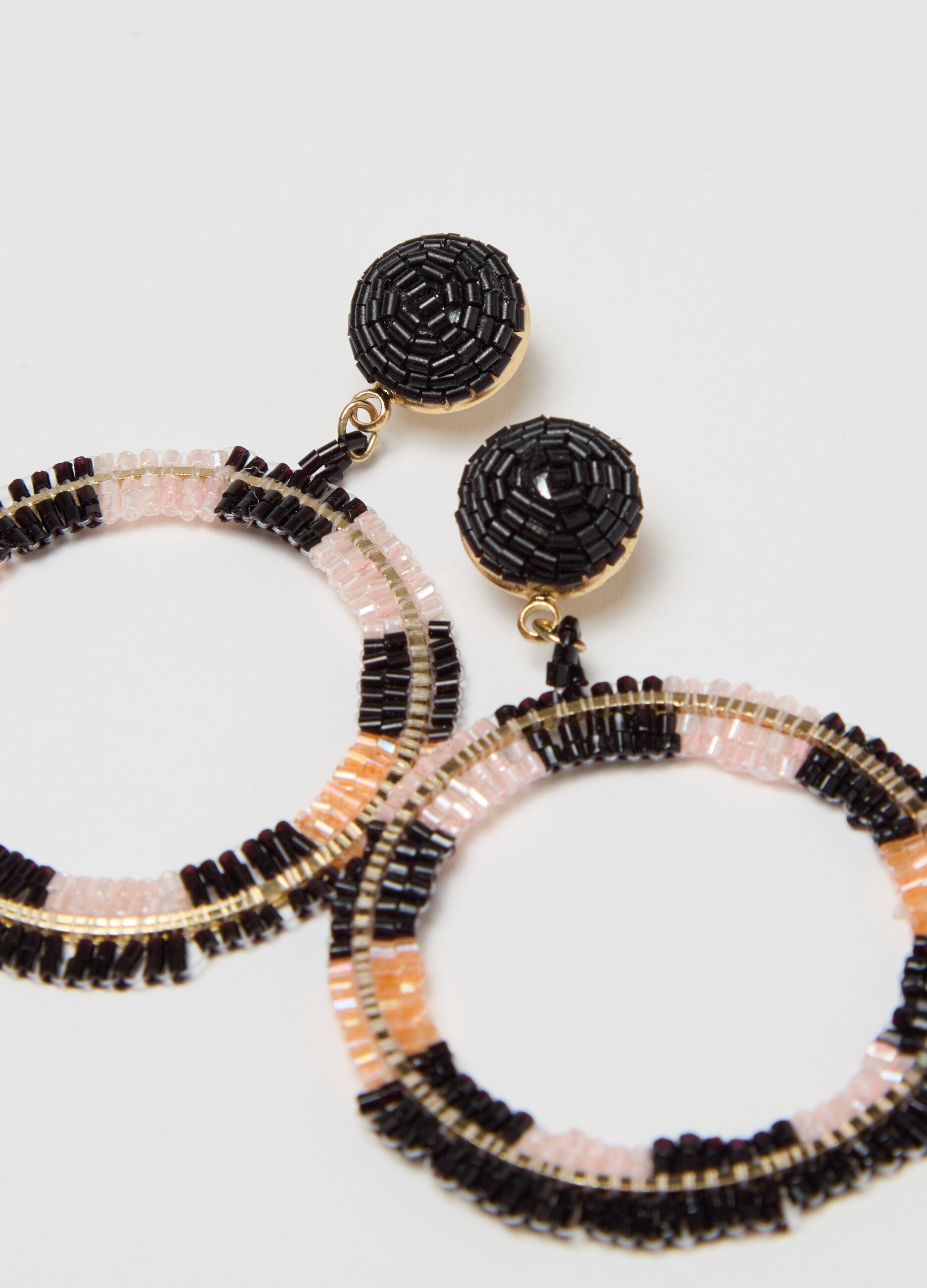 Earrings with beads and circle pendant