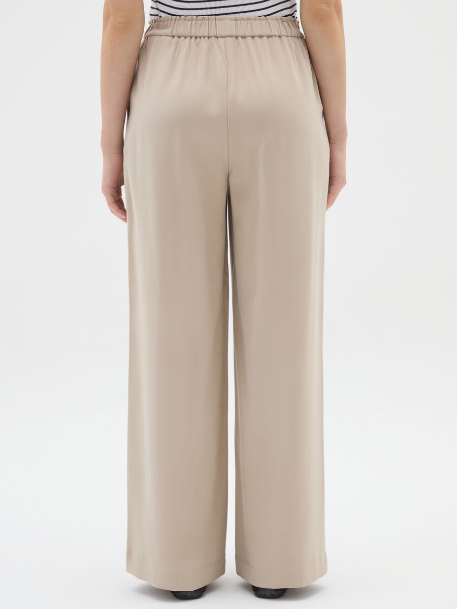 Pantaloni The Iconic Pants beige a gamba larga_2