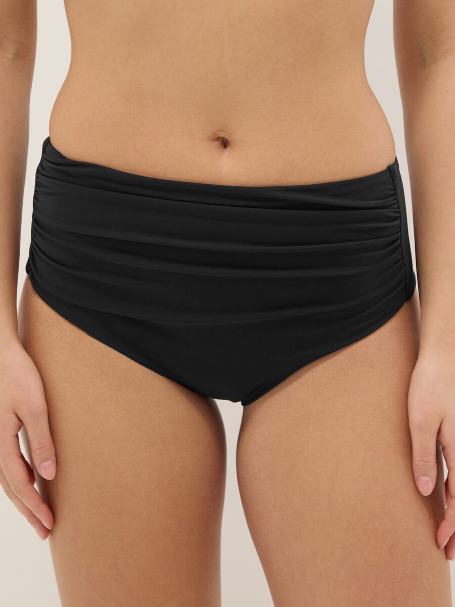 Slip bikini neri in tessuto elasticizzato a vita alta con effetto shaping_1