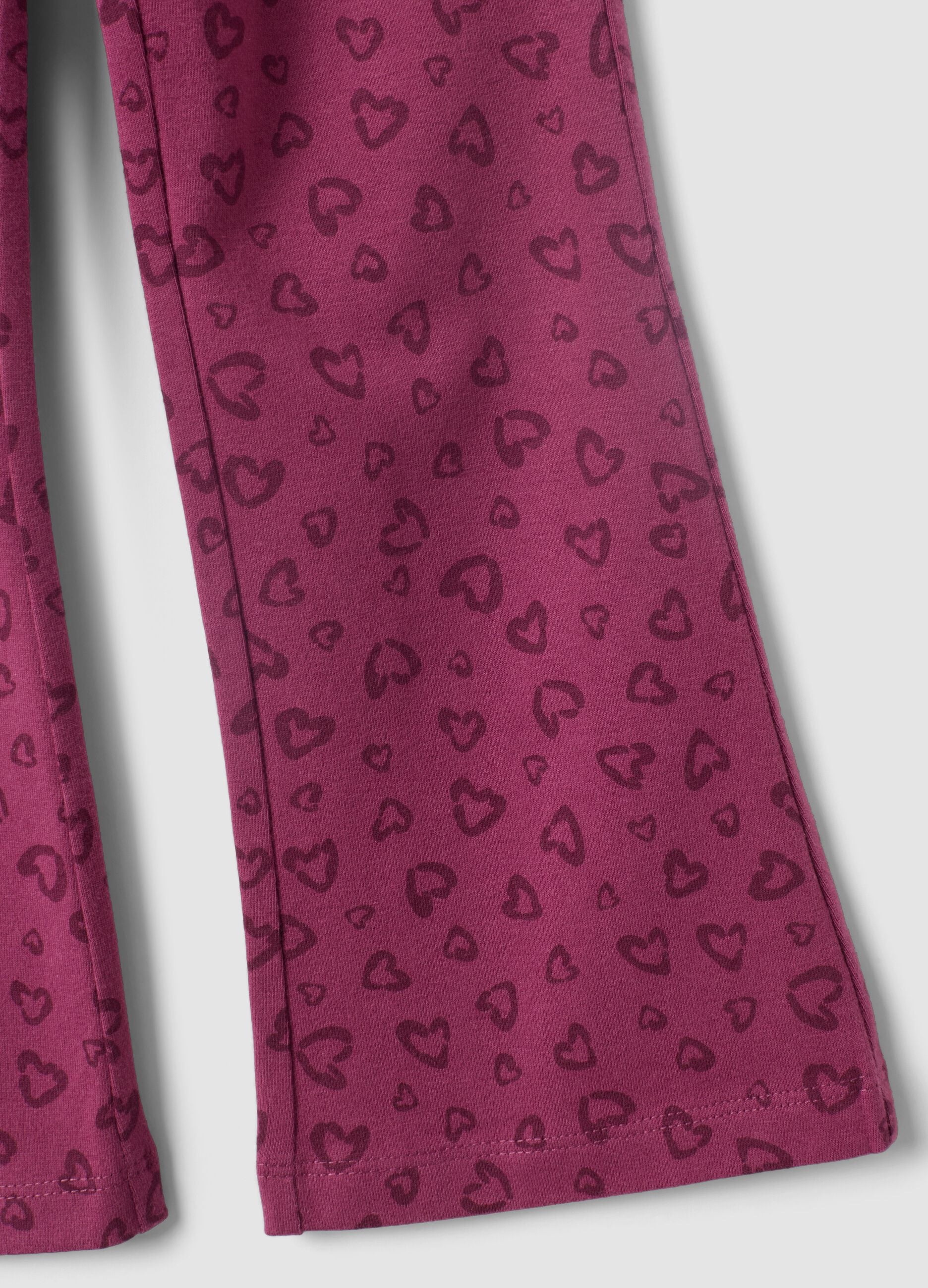 Leggings skinny viola in cotone organico con stampa di cuori per bambina