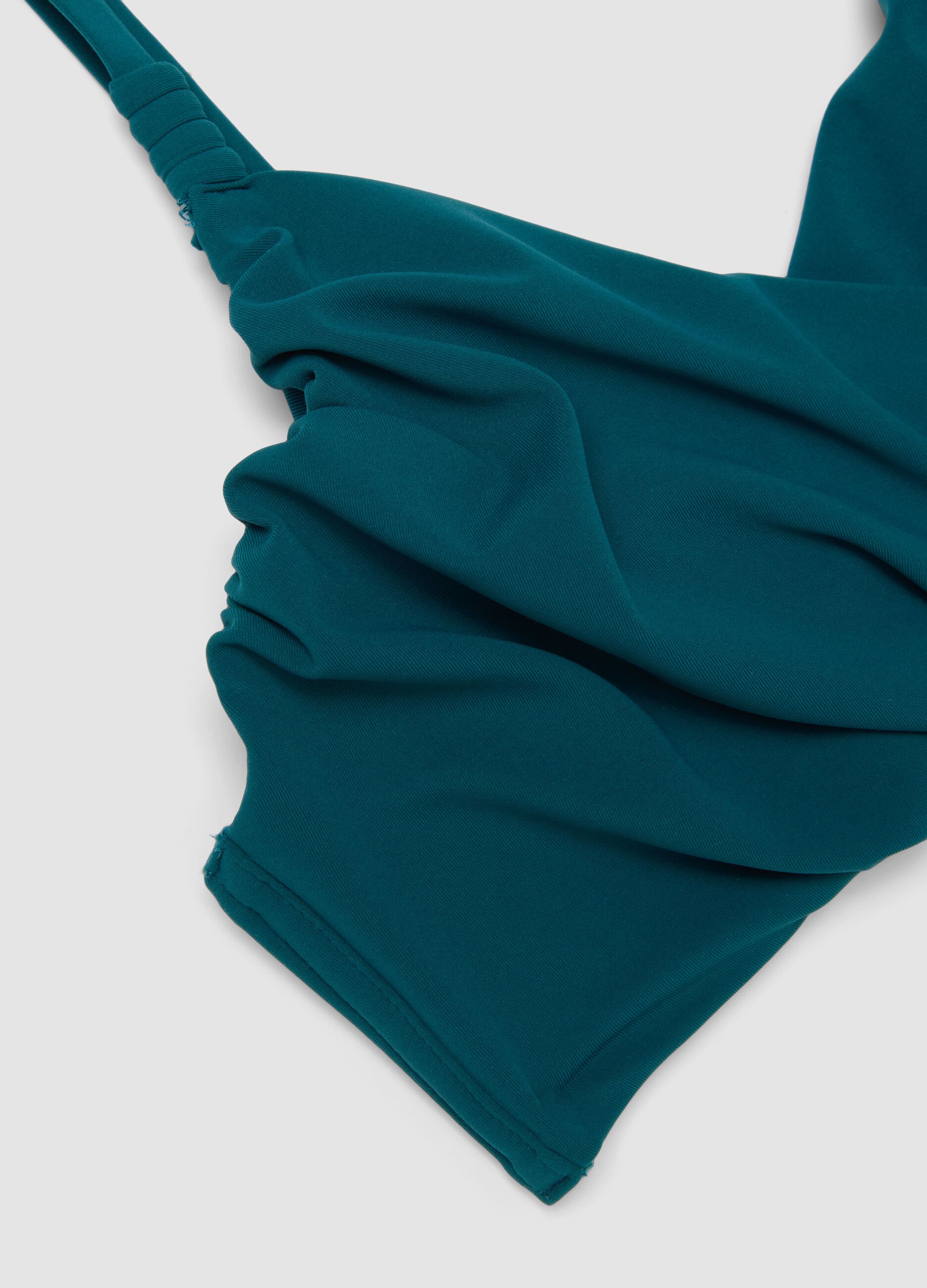Top bikini verde in tessuto elasticizzato con effetto shaping