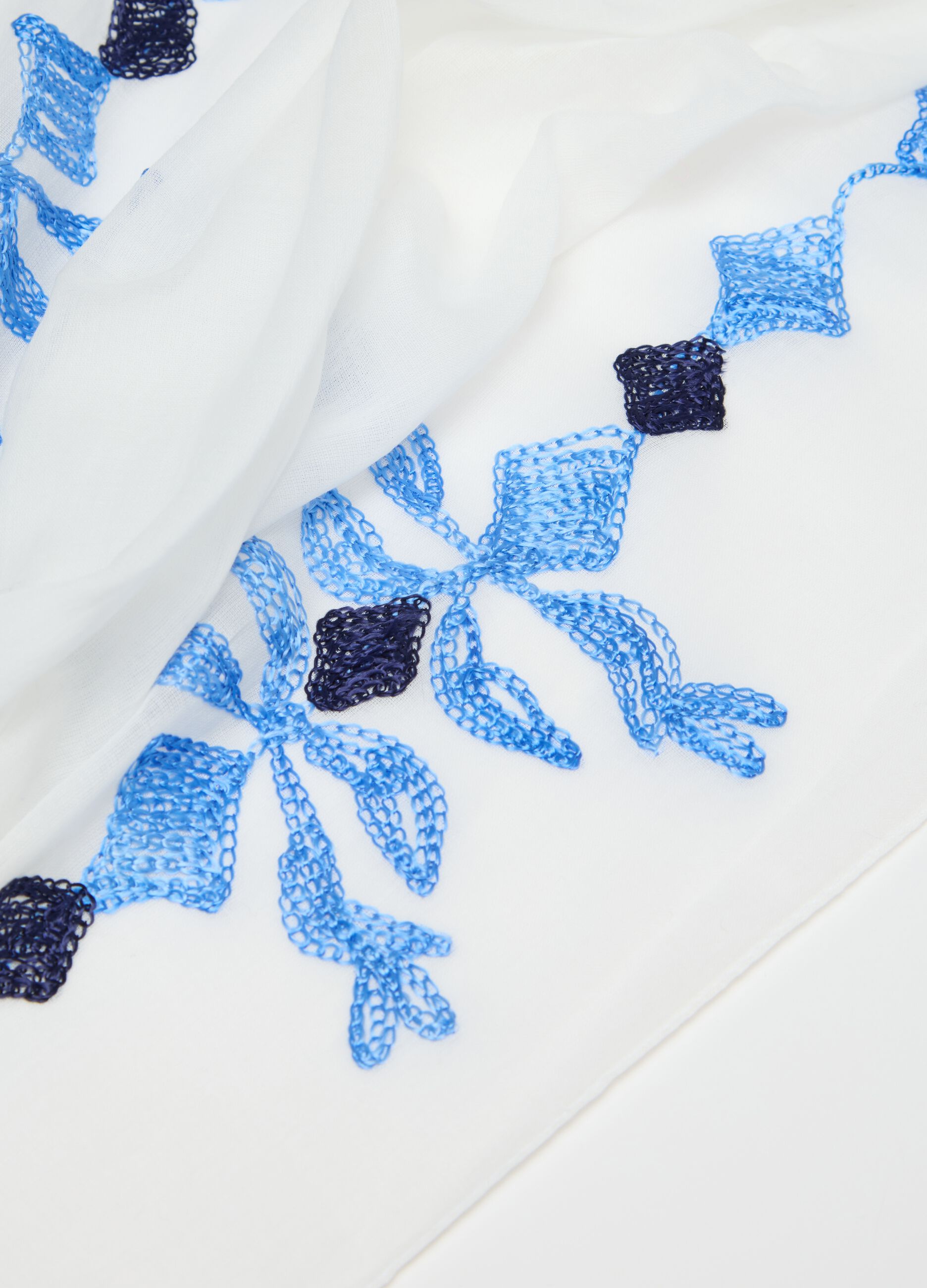White and blue scarf with embroidery and tassels