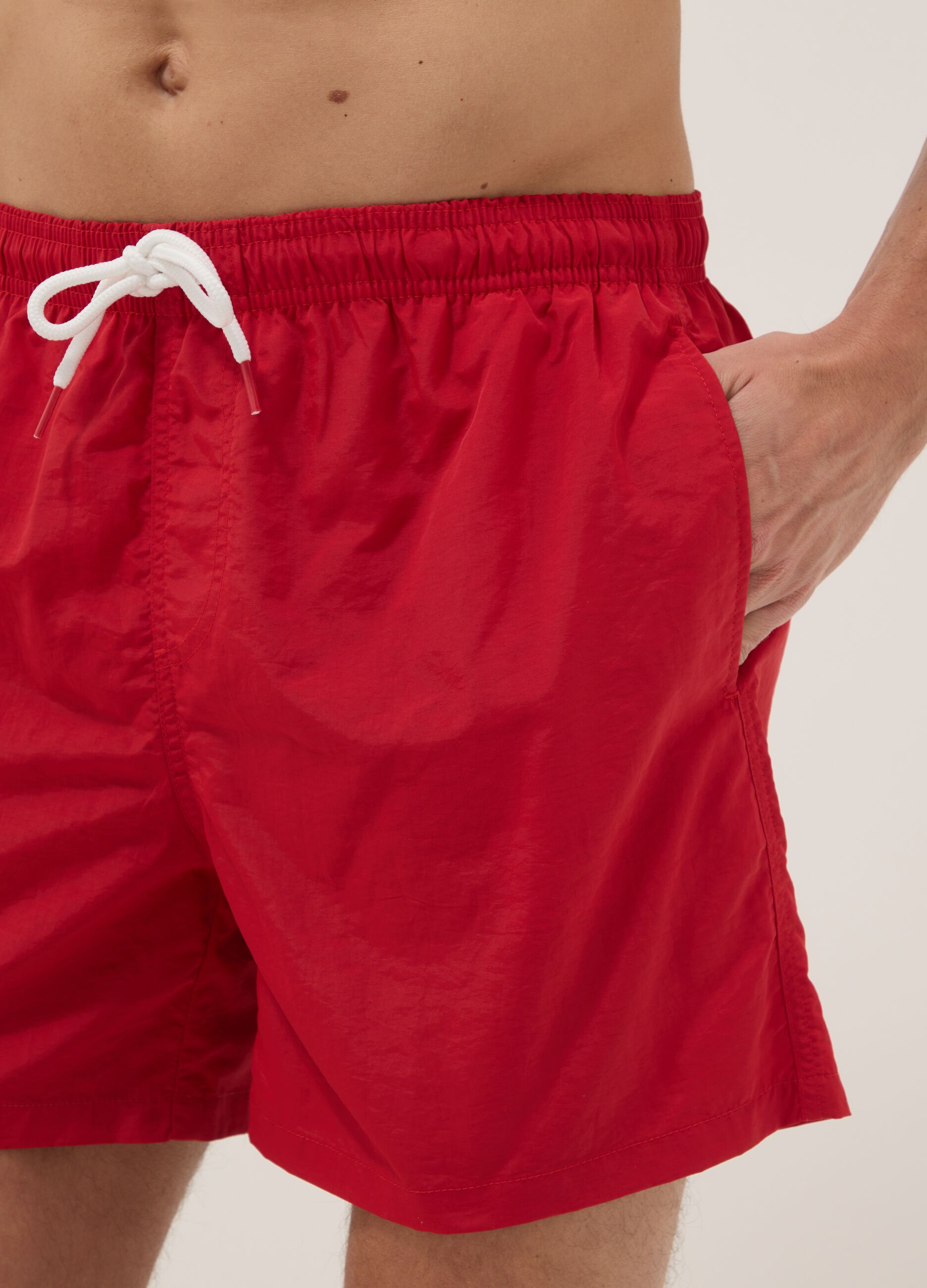 Red swim shorts with elasticated waist
