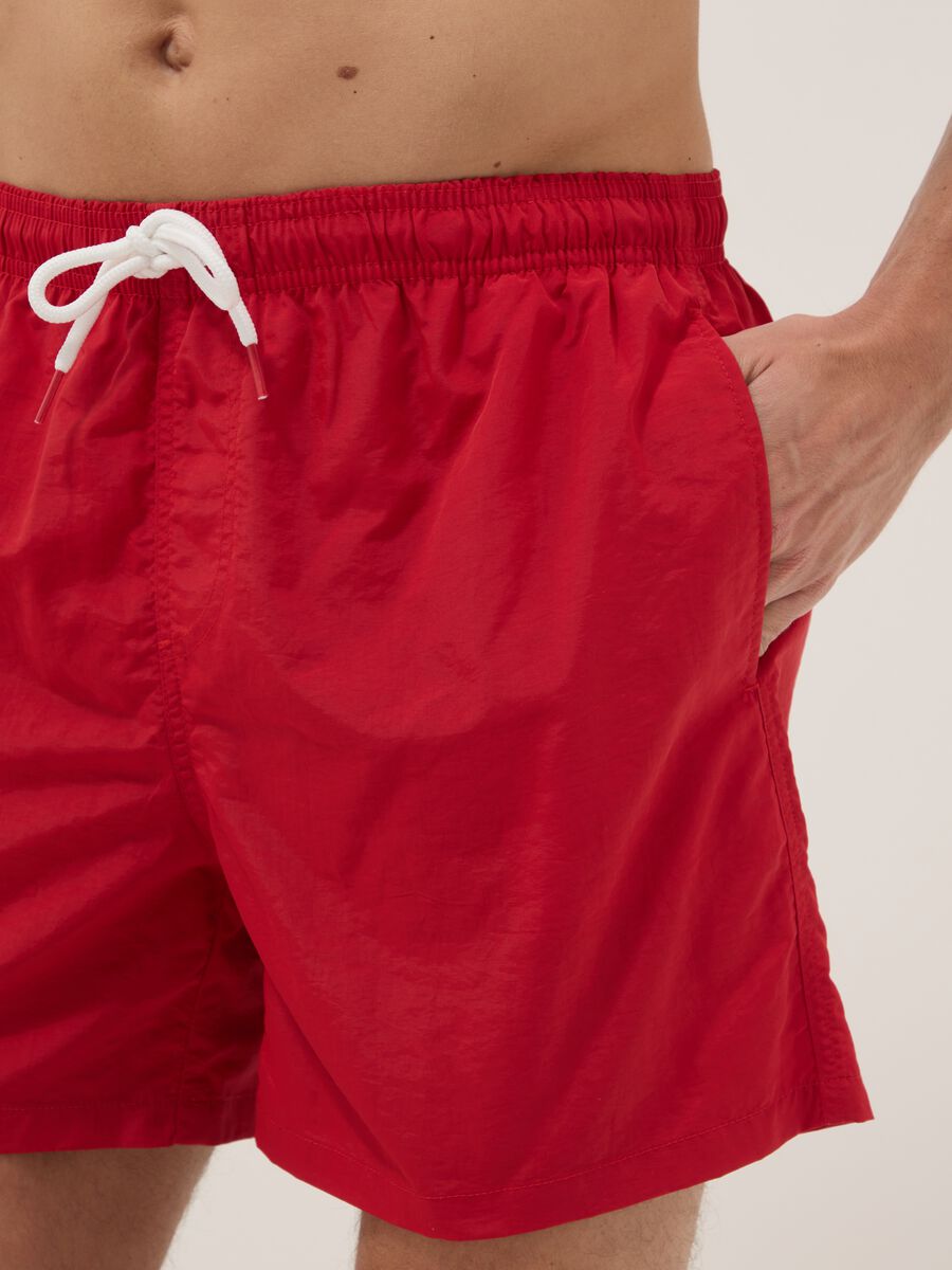 Red swim shorts with elasticated waist_3
