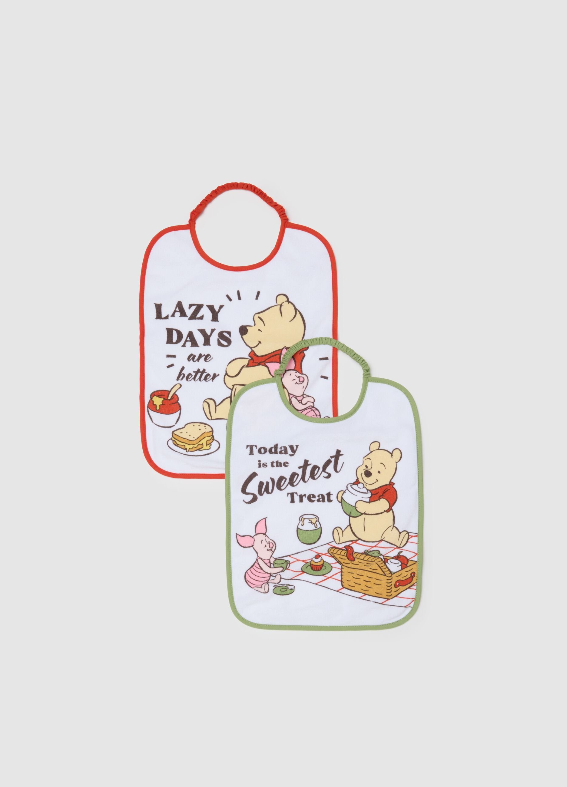 Twin-pack of white cotton mix bibs for newborn girls with Winnie the Pooh