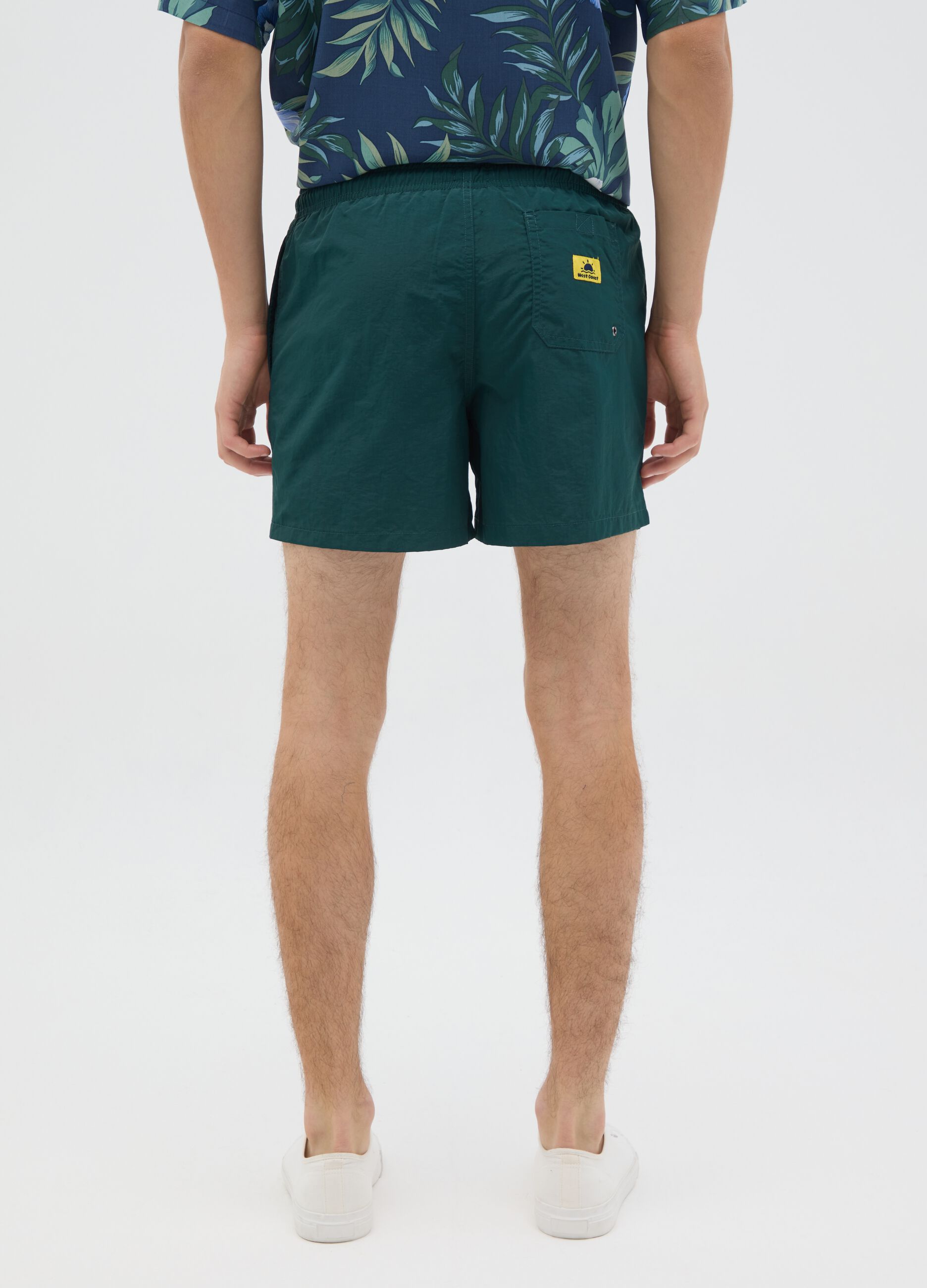 Green mixed fabric swim shorts