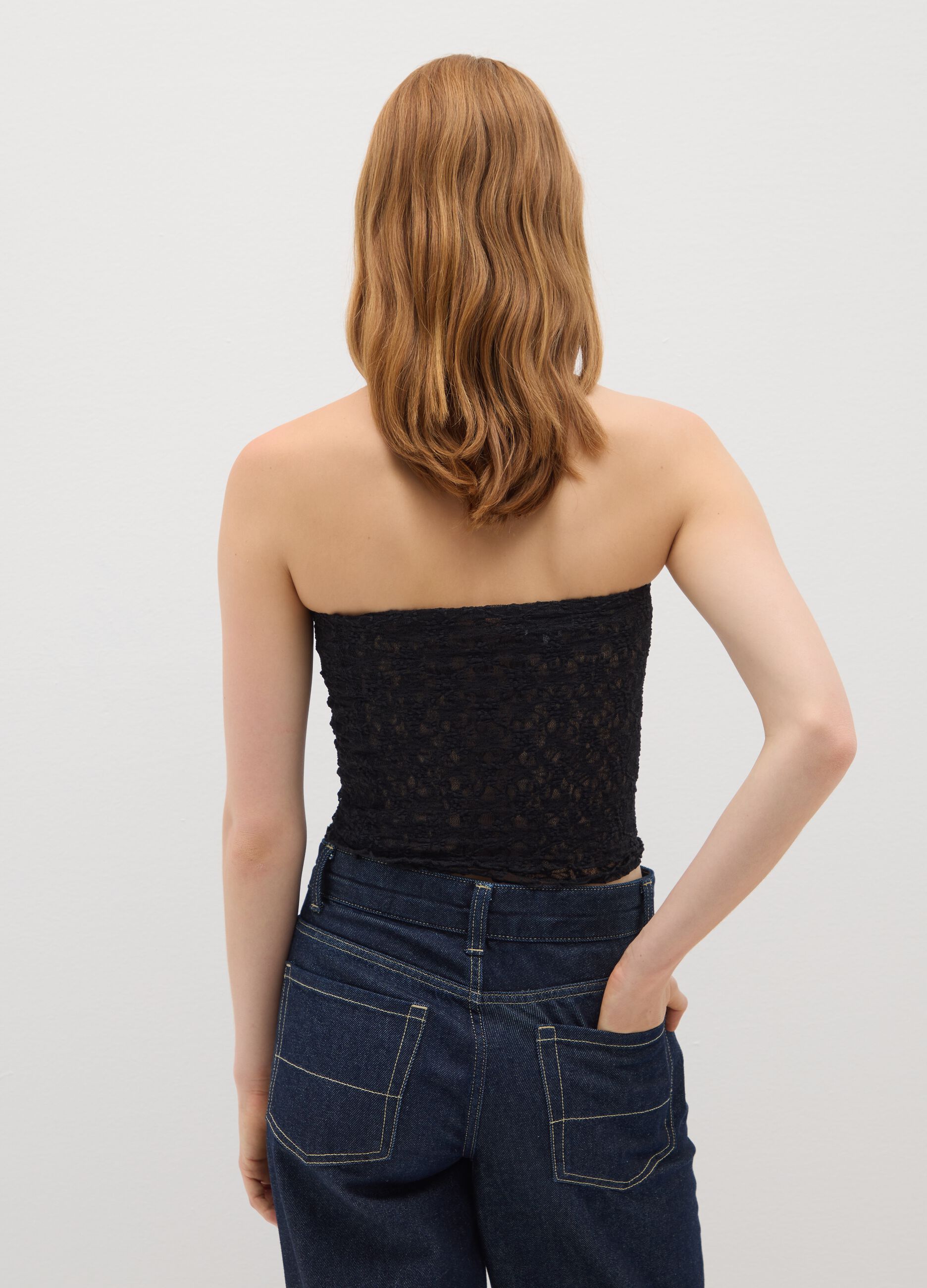Top a fascia in pizzo nero fitted