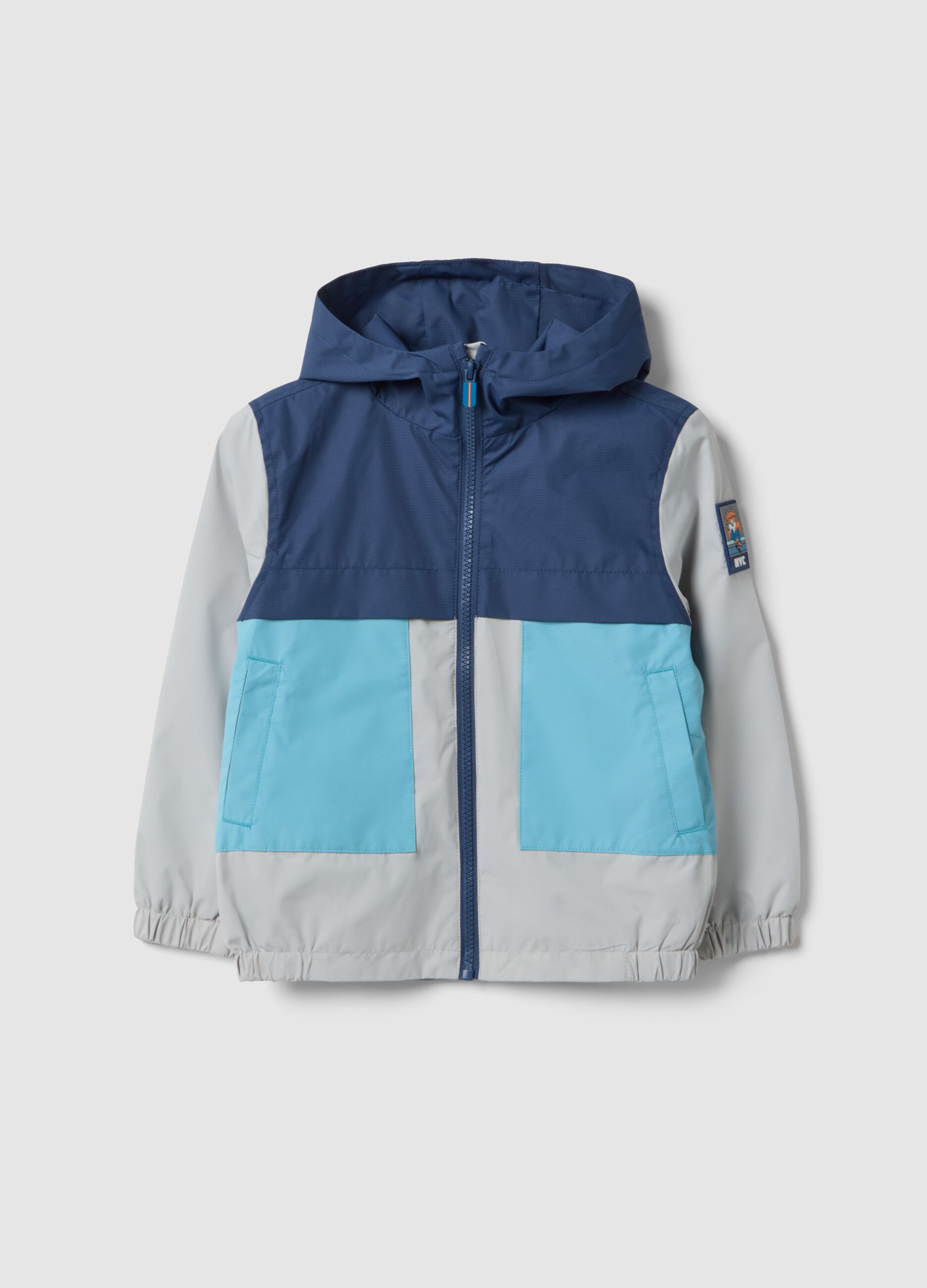 Giacca impermeabile multicolor con cappuccio e zip per bambino