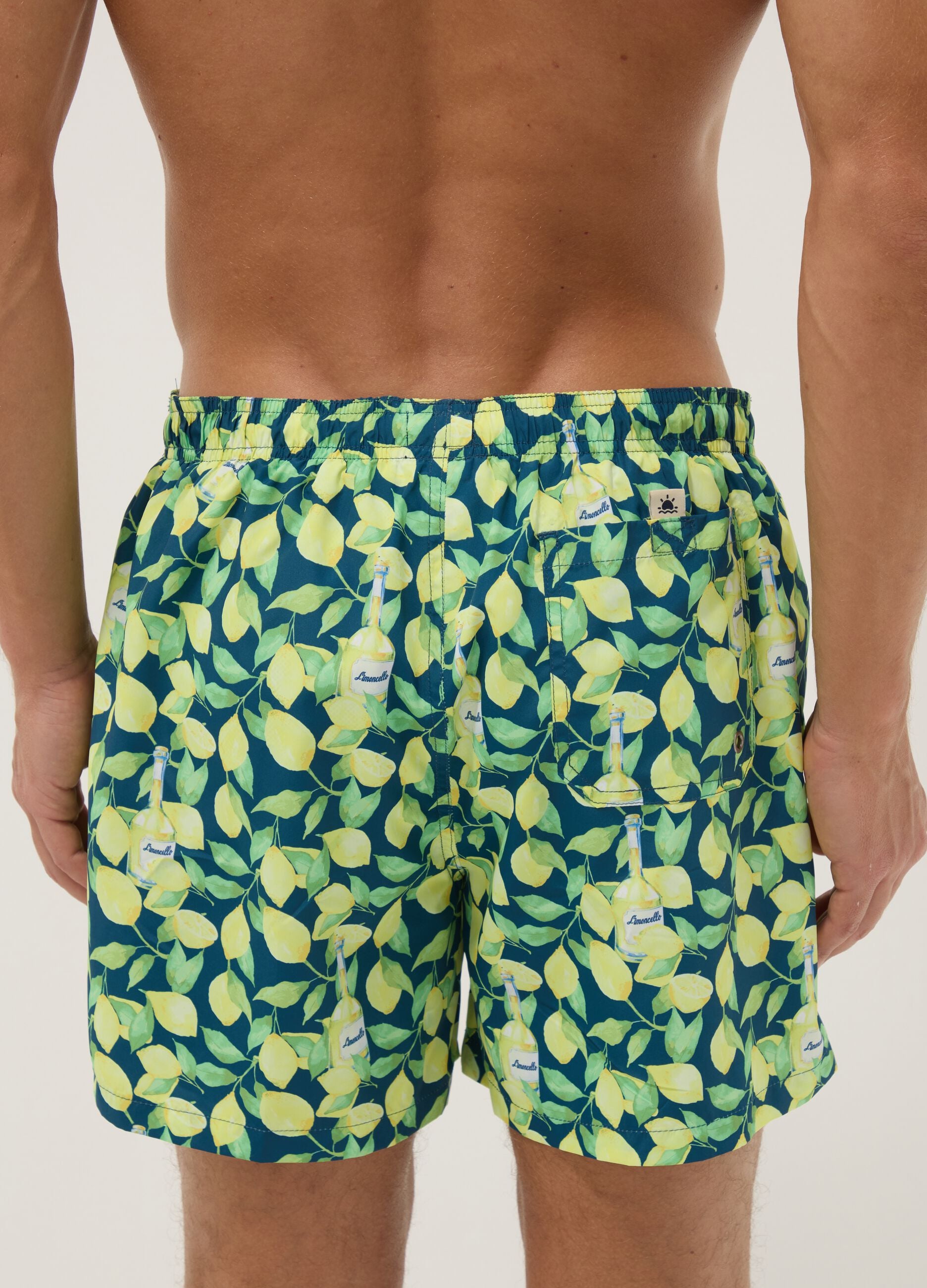 Blue boxer swim shorts with Limoncello print