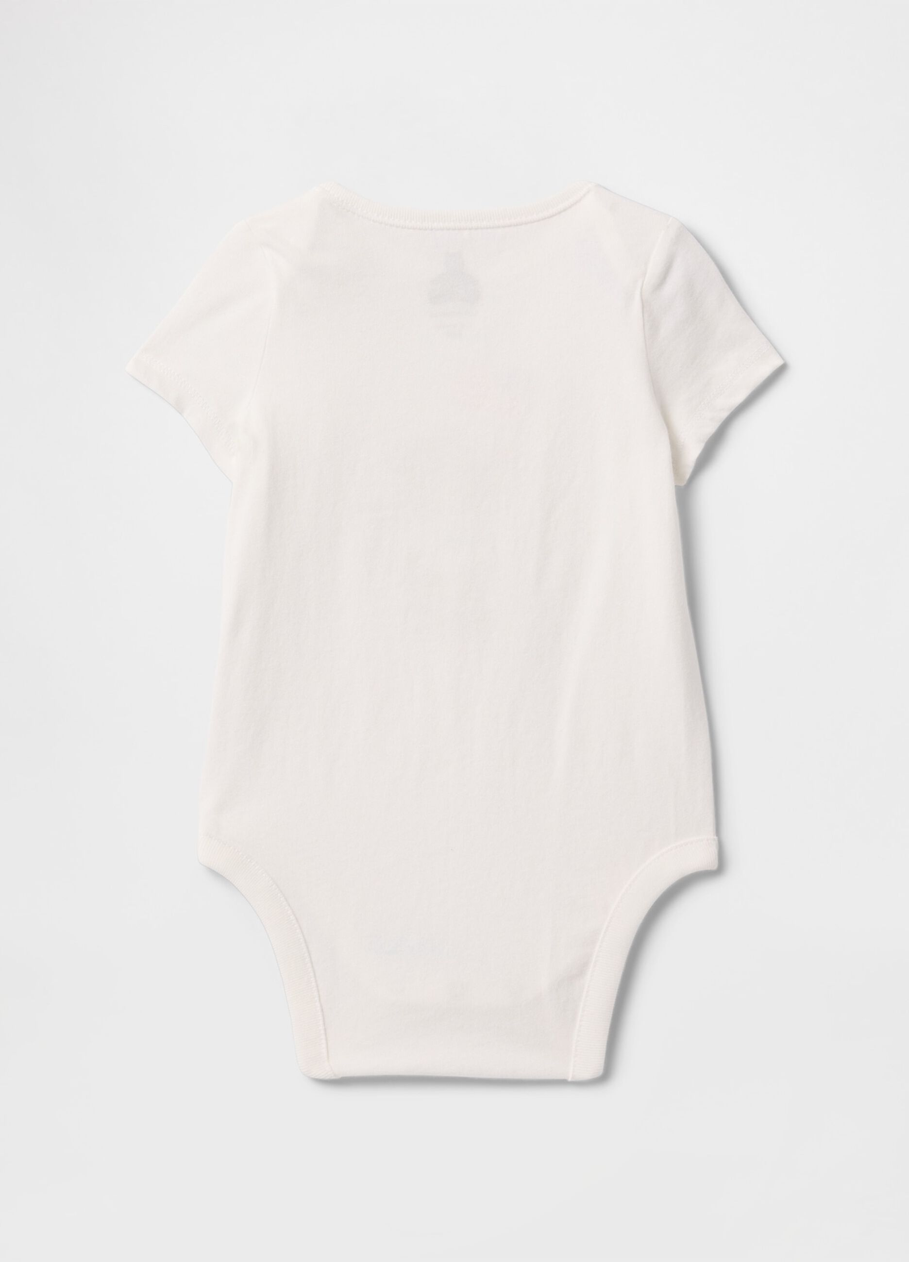 White newborn body with GAP teddy bear