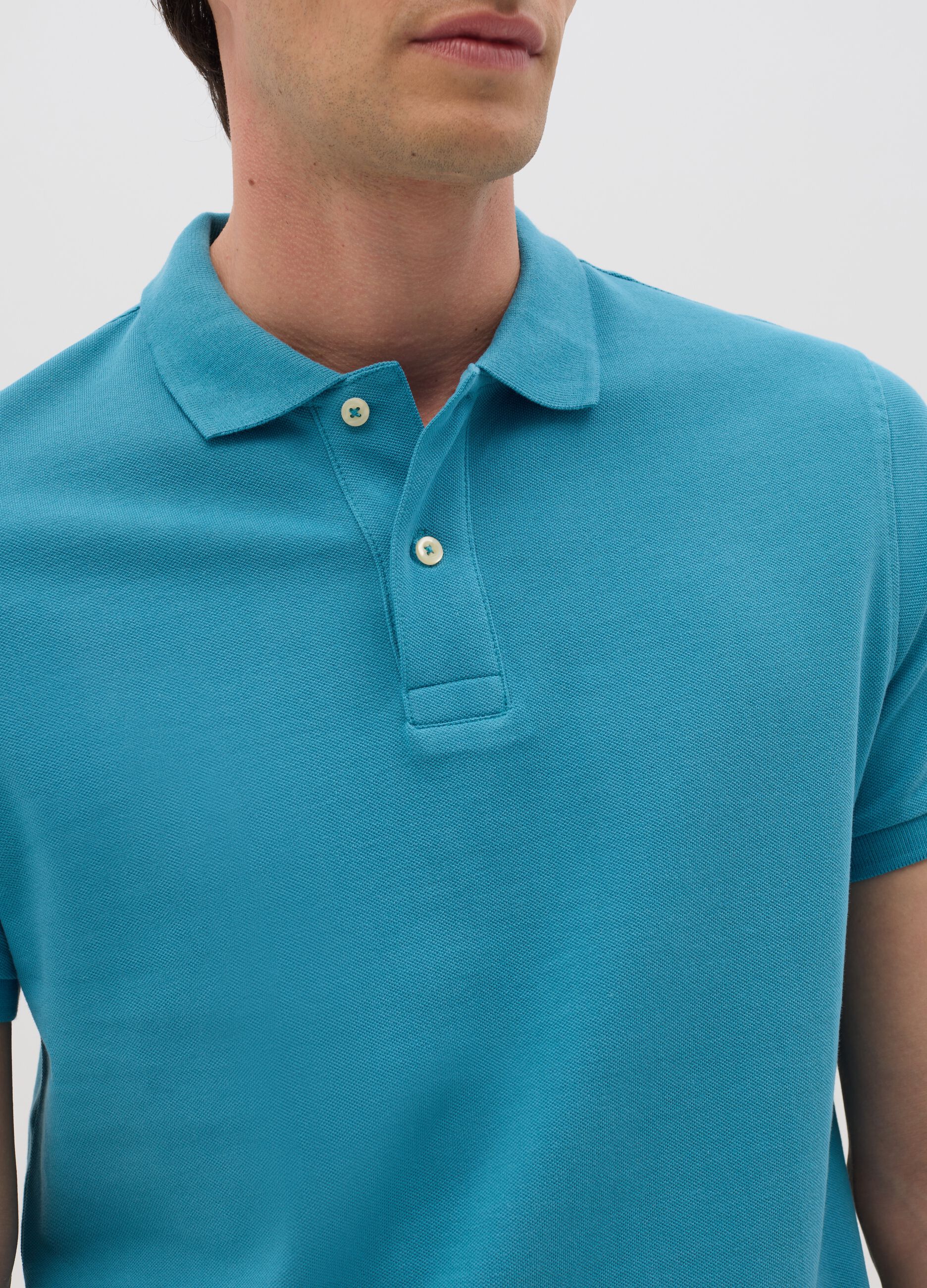Men’s light blue polo shirt in 100% cotton with regular fit