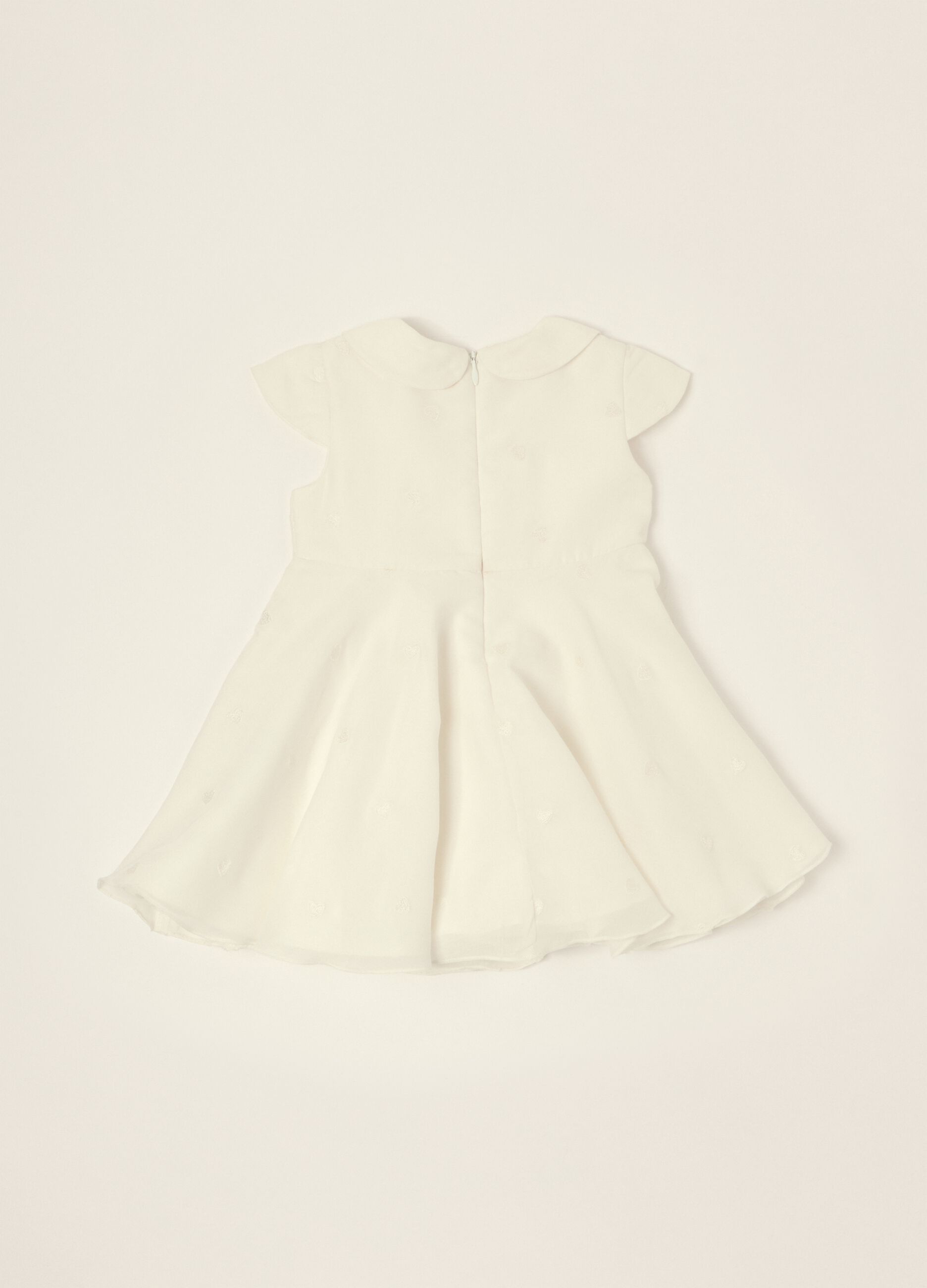 White dress with embroidered details